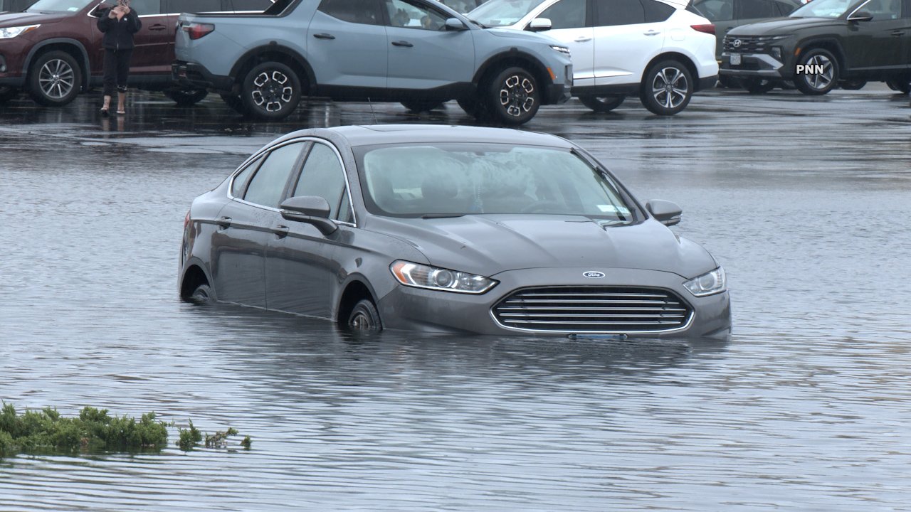 Driver Plows Through Levittown Floodwaters Seconds After Tow Truck Recovery of Stranded Vehicle