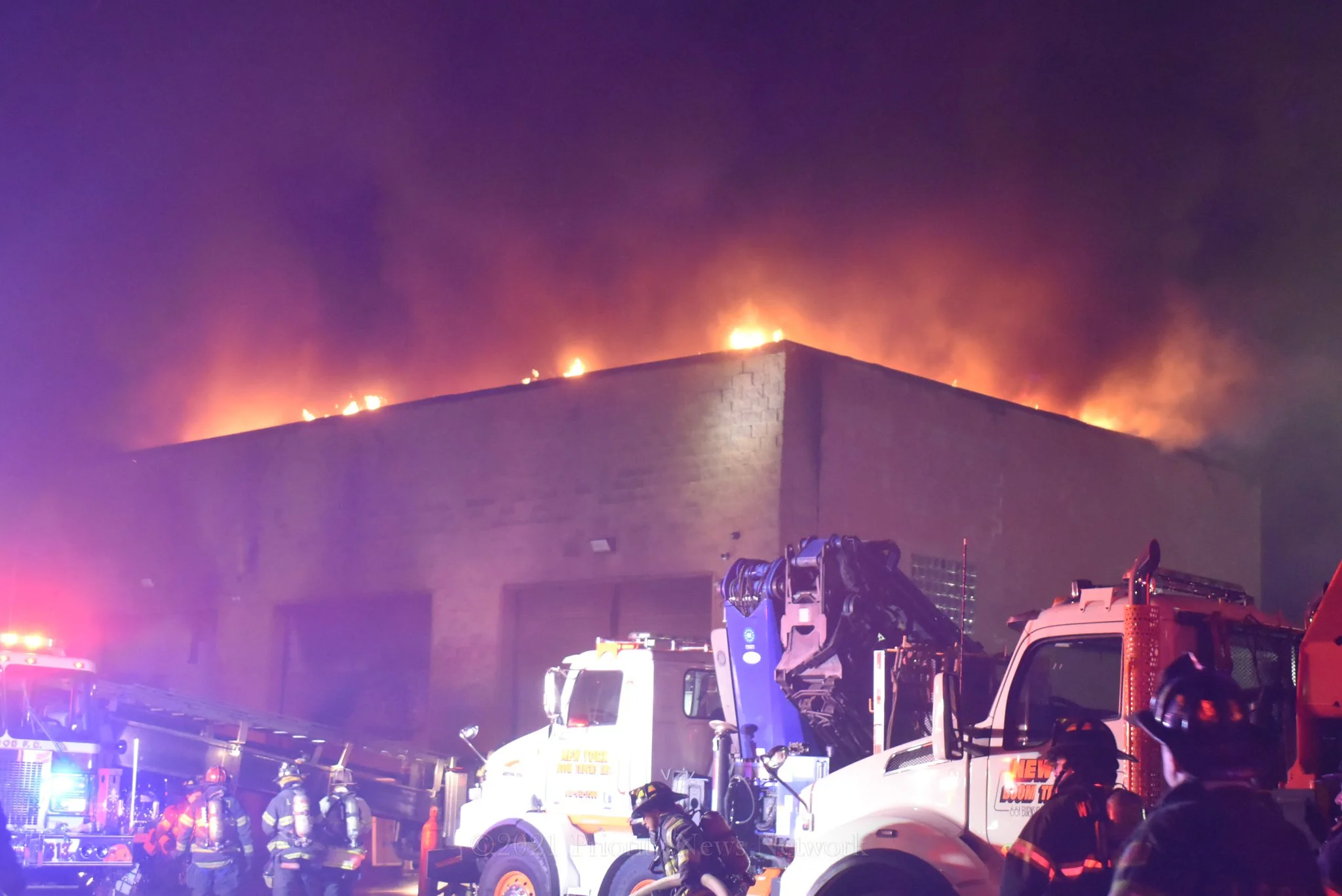 Warehouse, Trucks Heavily Damaged In Overnight Fire