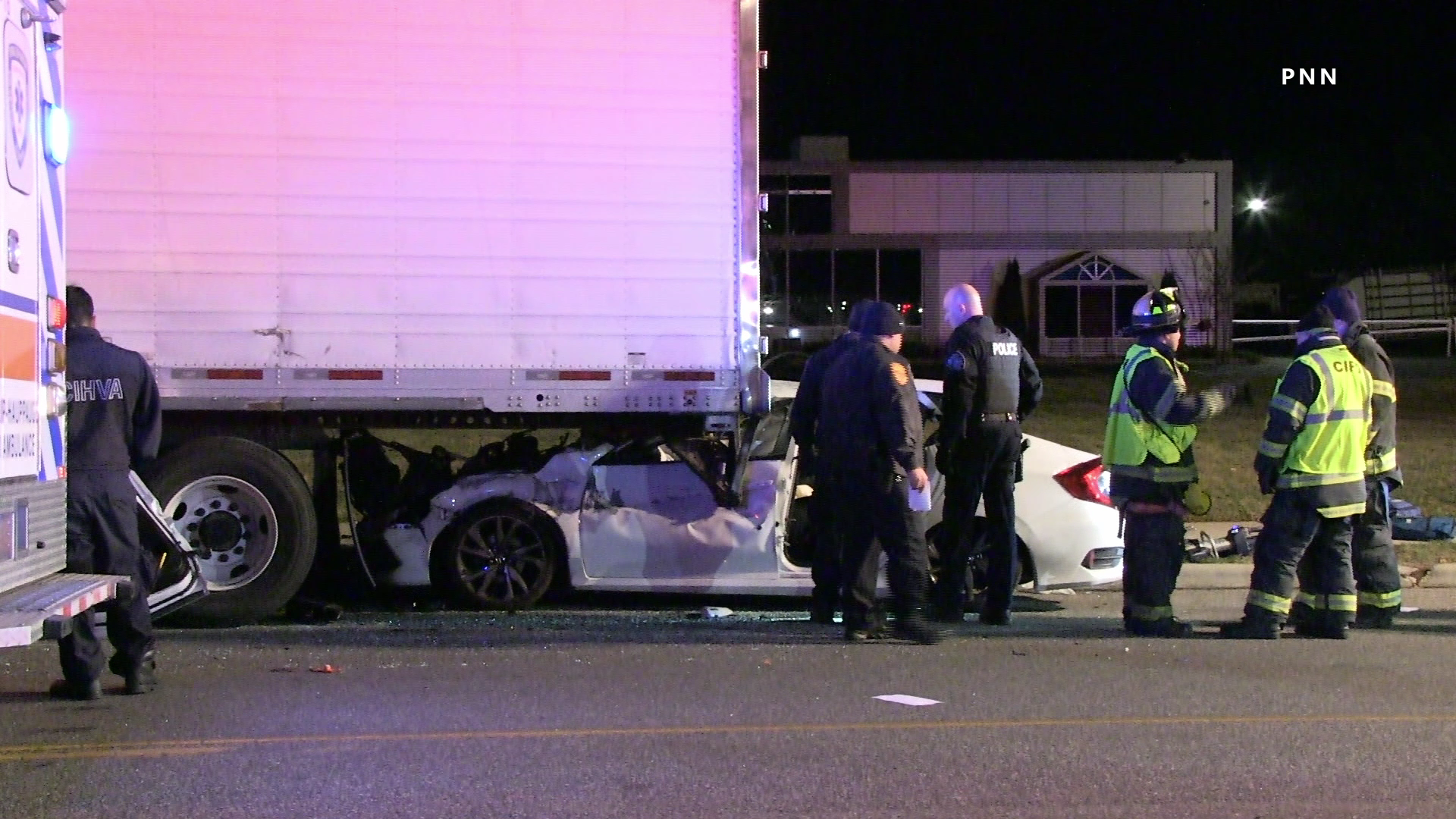 Car Slams Into Parked Tractor Trailer, Driver Extricated