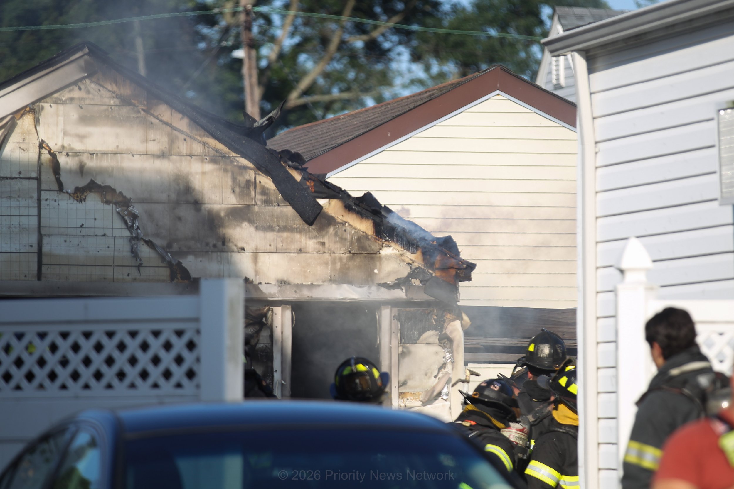 Heavy Smoke Erupts as Firefighters Battle Garage Fire in Bethpage