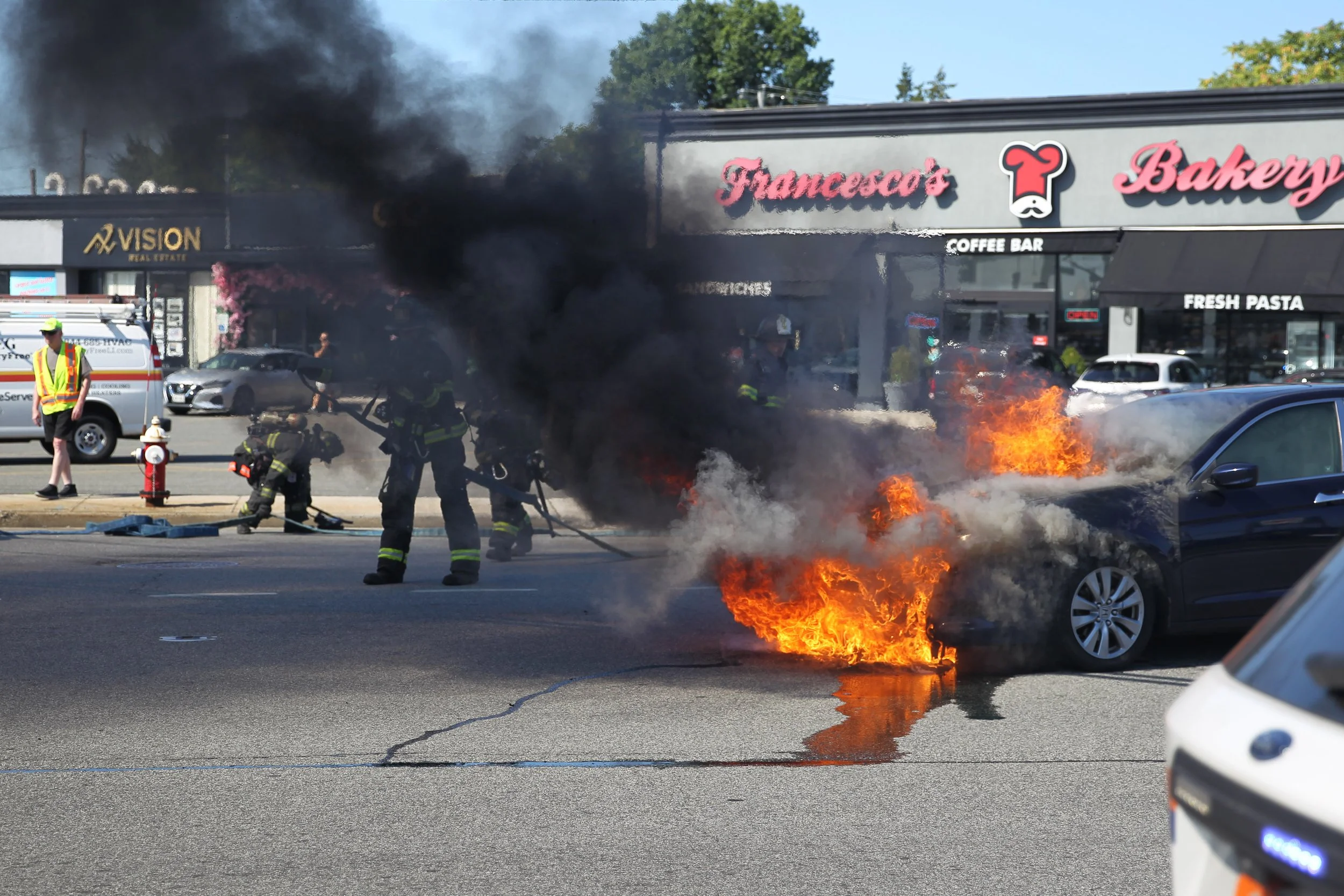 Car Fire Erupts at Busy Hicksville Intersection, Driver Escapes Injury