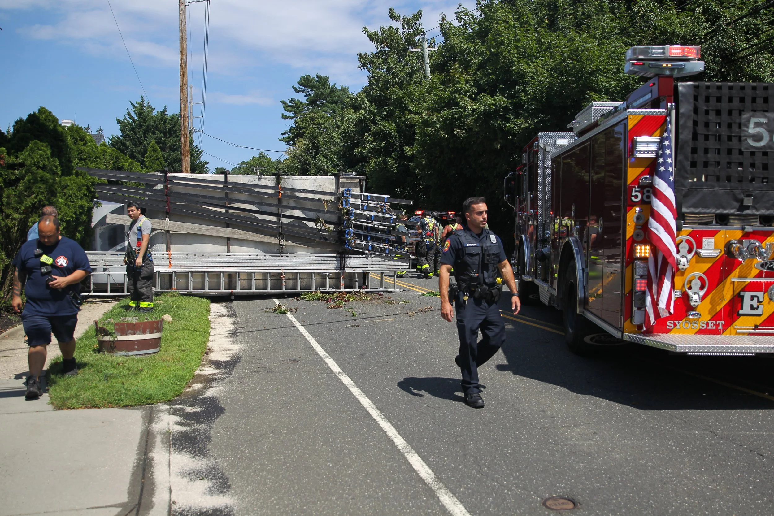 Box Truck Overturns, Crashes Into Front Yard Following Syosset Collision