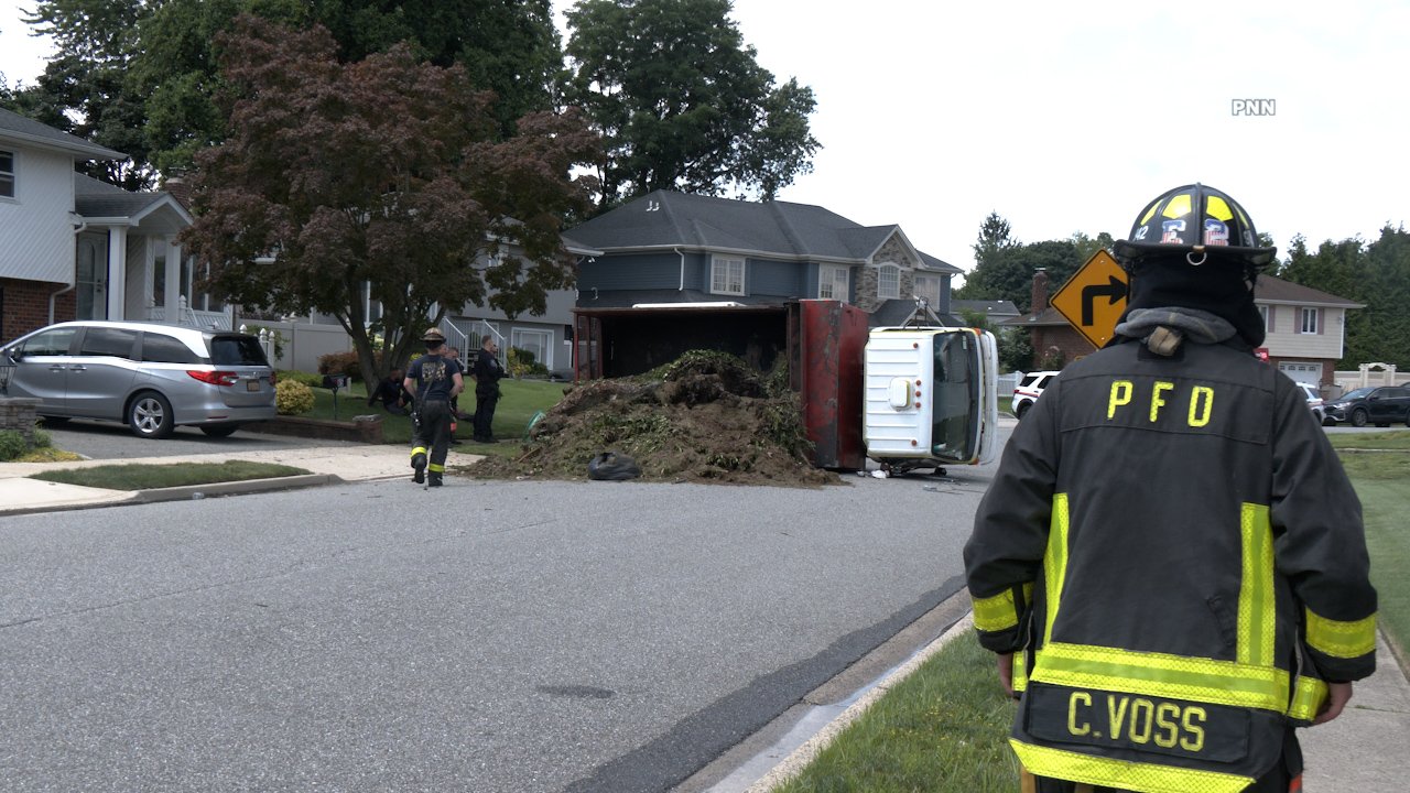 Landscaping Truck Overturns on Residential Street in Plainview