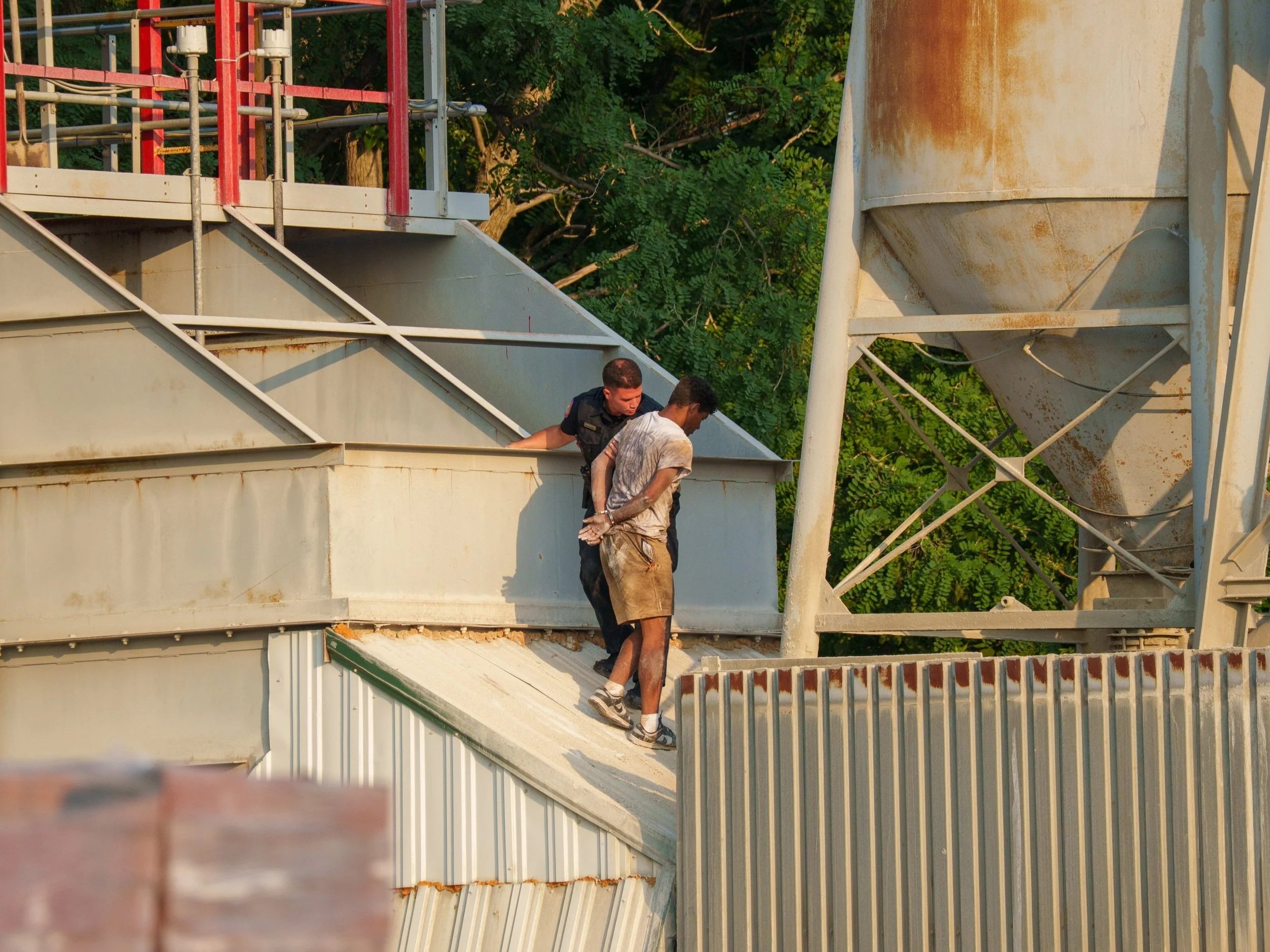 Man Arrested After Fleeing Into Woods, Hiding Atop Industrial Hopper in Inwood