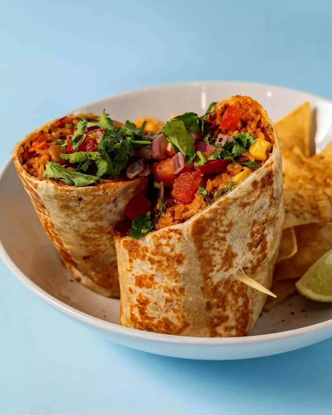 Lil Burrito Wrap, built fresh with your choice of protein and heat - from chill to full bull.
Dirty rice, beans, cheese, guac, jalape&ntilde;os, lime.
Wrapped. Rolled. Ready. 🐂