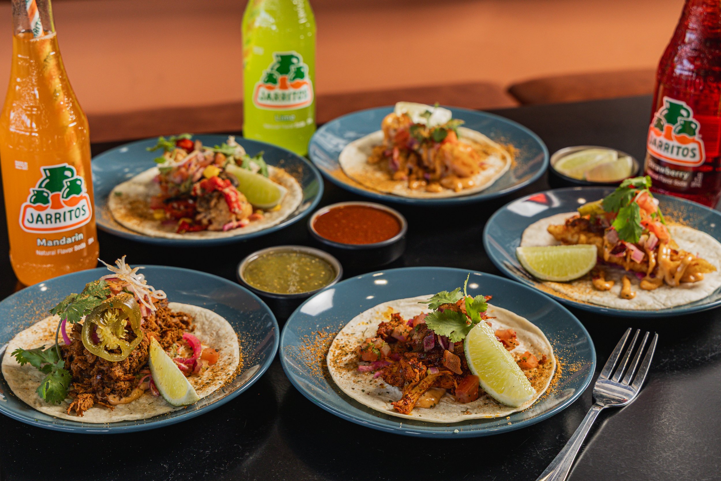 Spread tacos with Mexican sodas