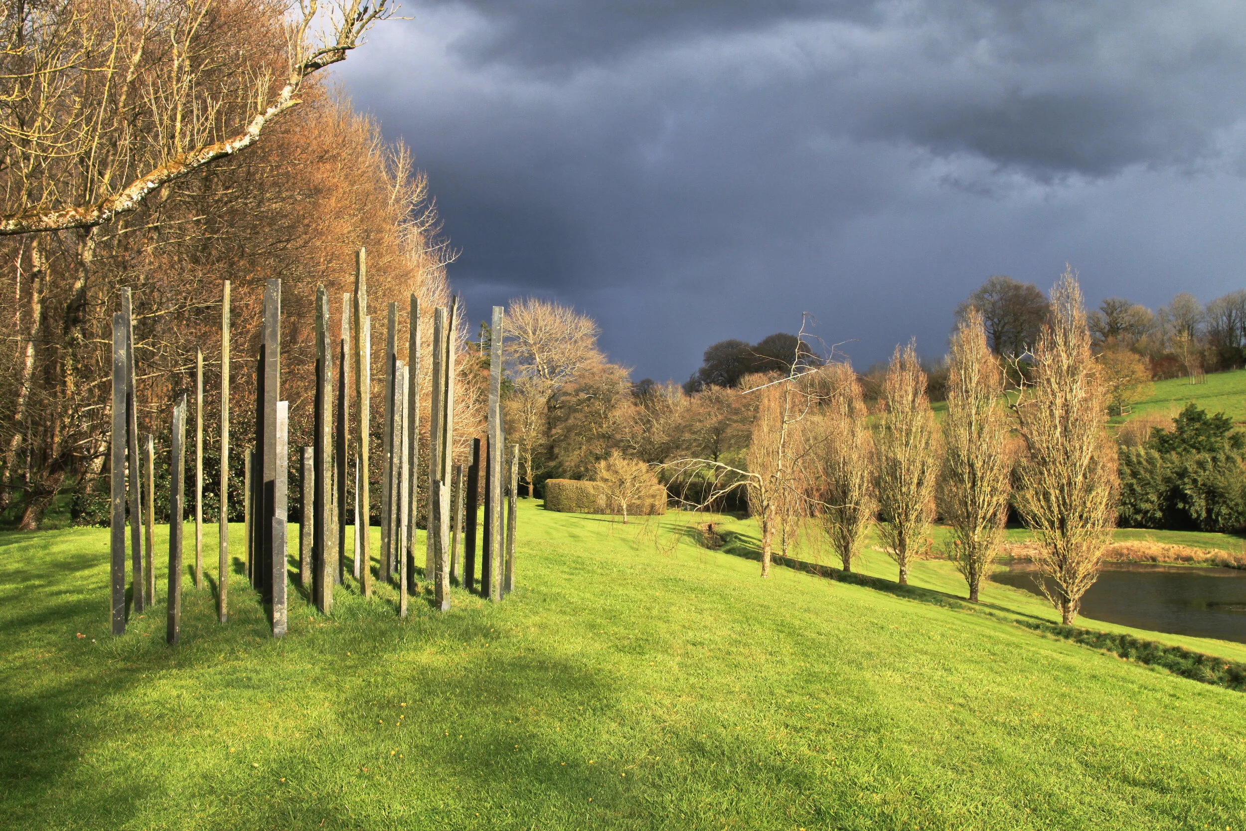 The main (Kairos) lawn with the slates on Orexis between April squalls, at Plaz Metaxu 