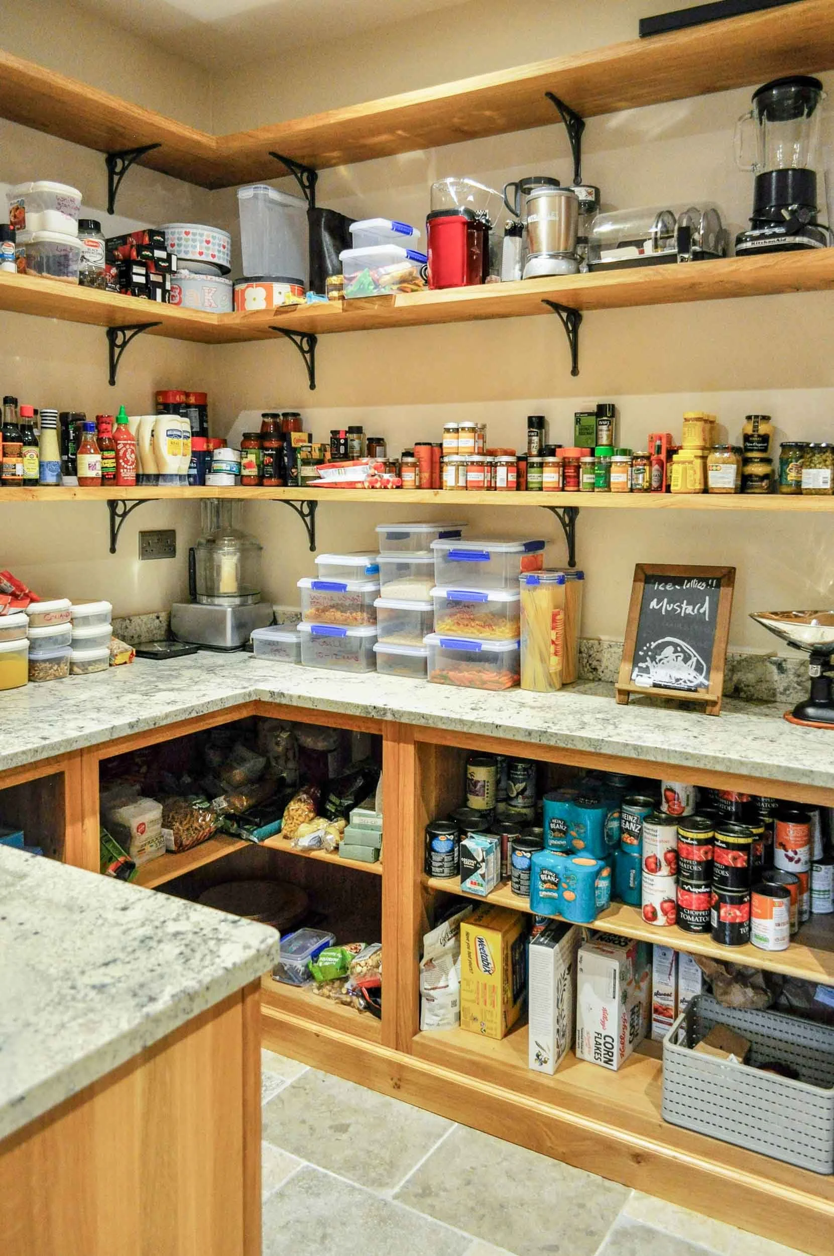 Walk in pantry with pippy oak cabinetry and shelving