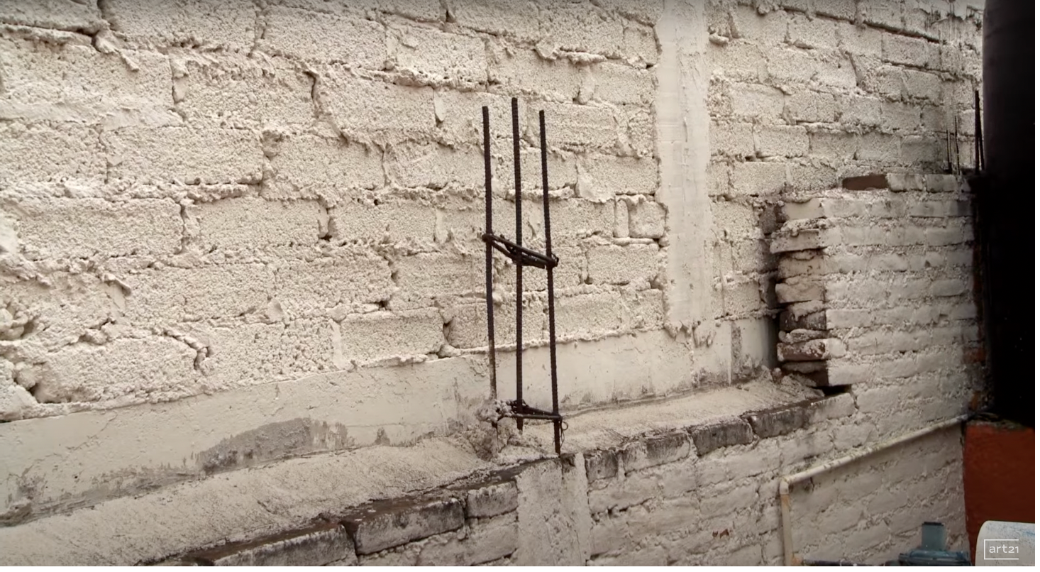 Figure 11. Rebar protruding from a wall of the Cruzvillegas family house, still from Legacy (Sollins and Dowling, 2014).