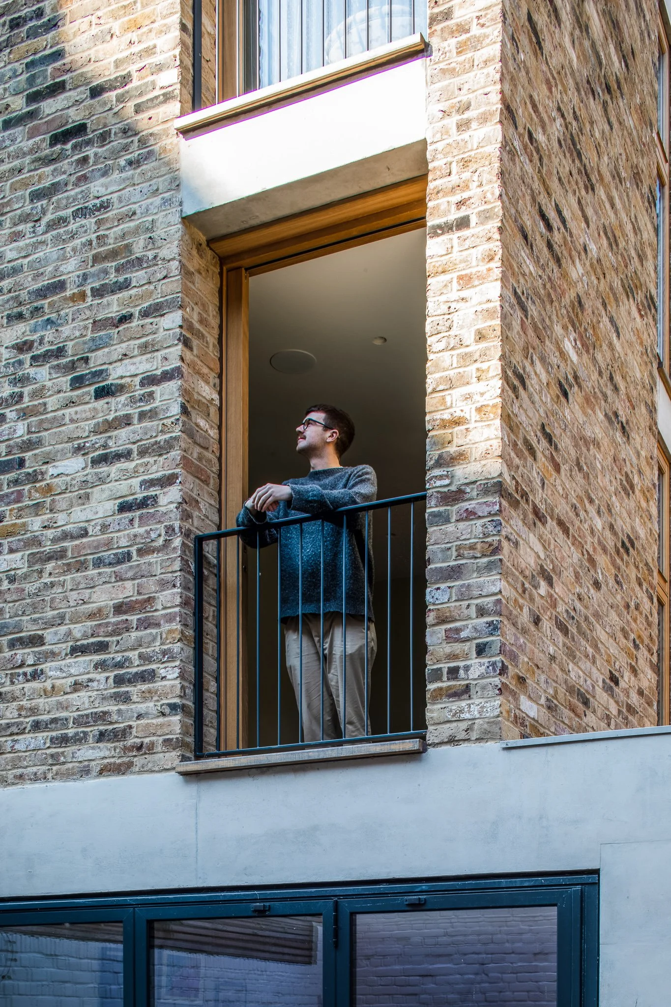 A moment of pause captured from a small balcony framed in brick and timber. The restrained material palette and simple detailing offer a quiet, contemplative space, emphasising human scale and the relationship between private interior spaces and the 