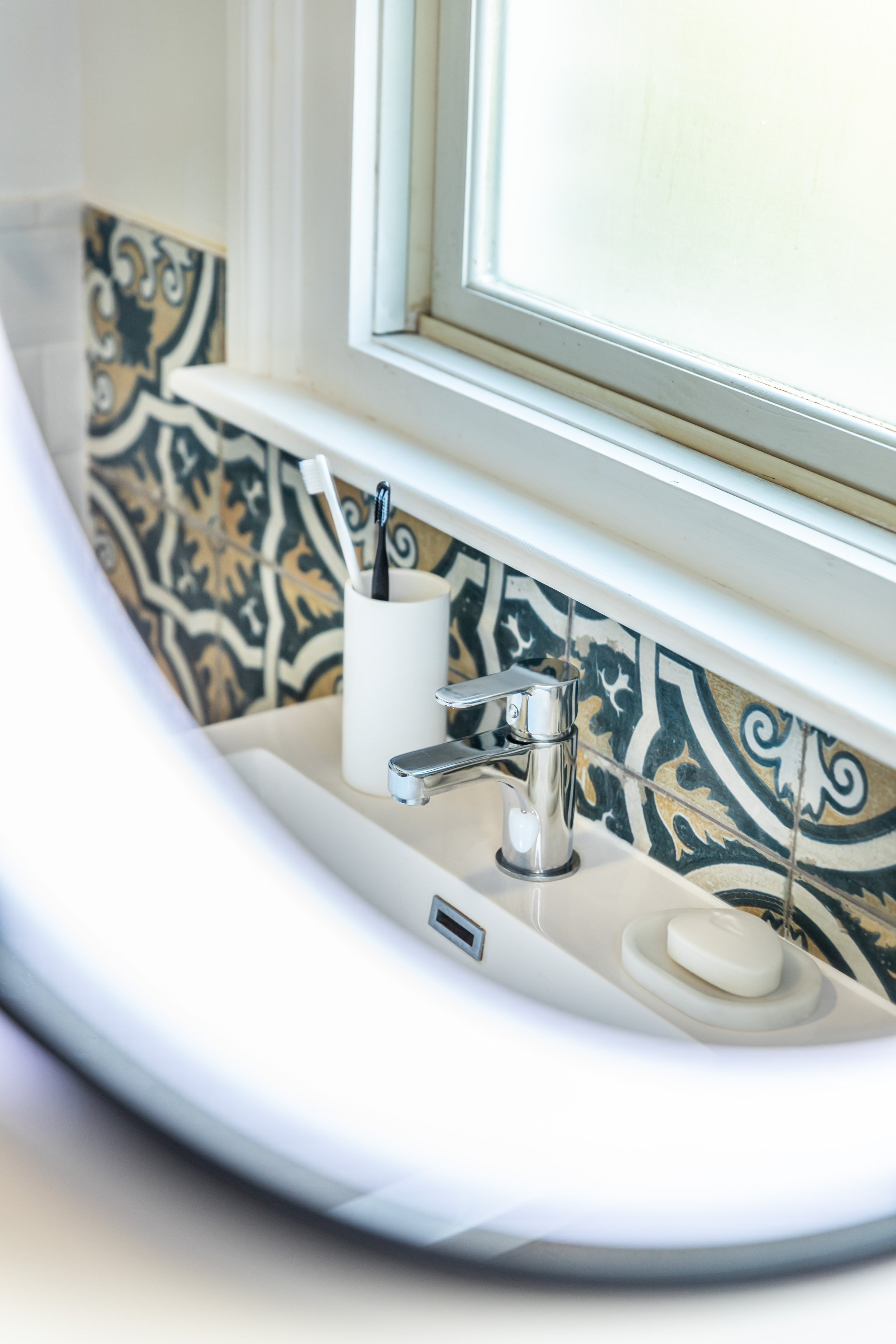 Reflection of vanity in bathroom mirror interior design London.jpg