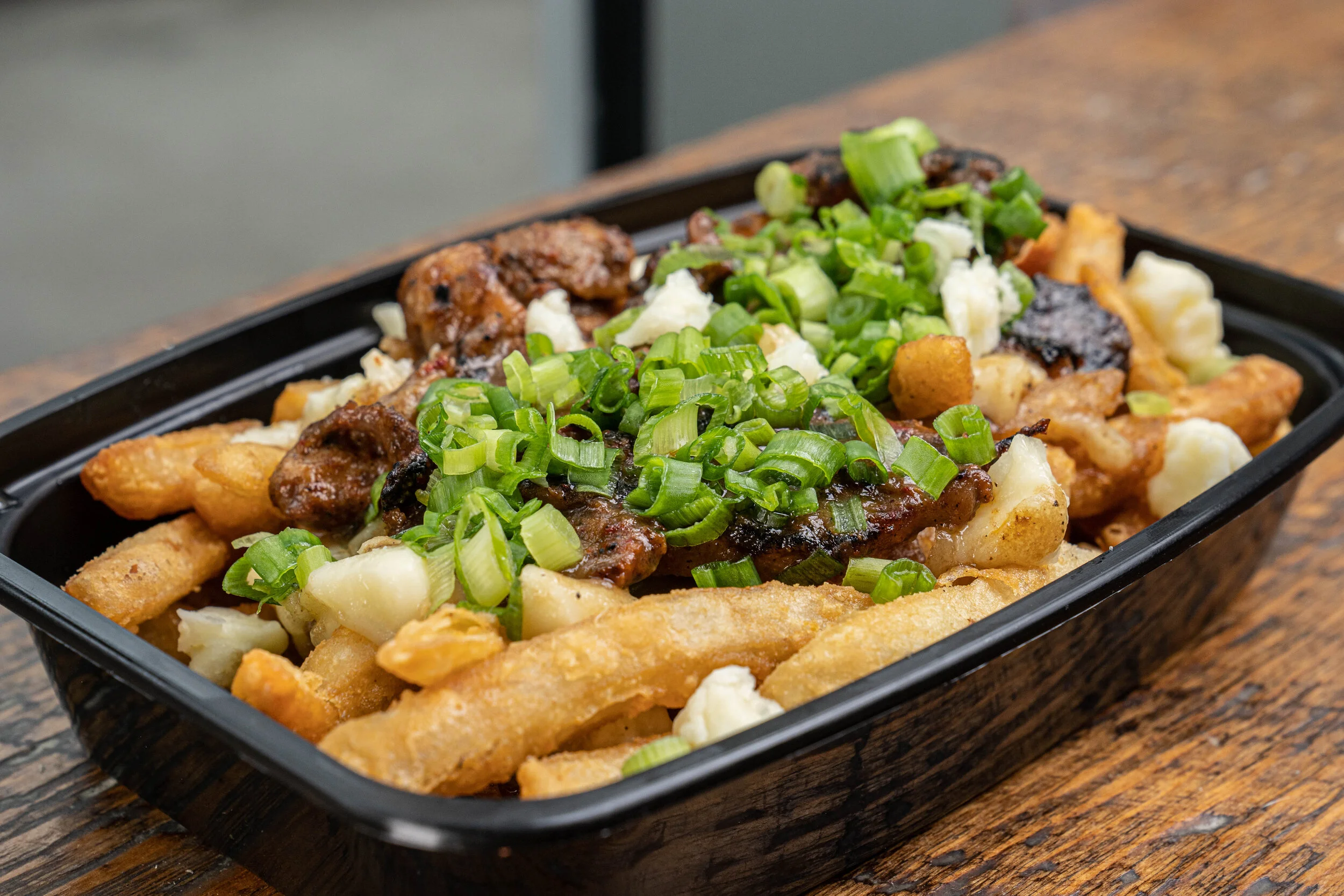 DYNASTY DUCK POUTINE (with duck) - Fries with duck protein, duck gravy, cheese curds, duck bits and green onions