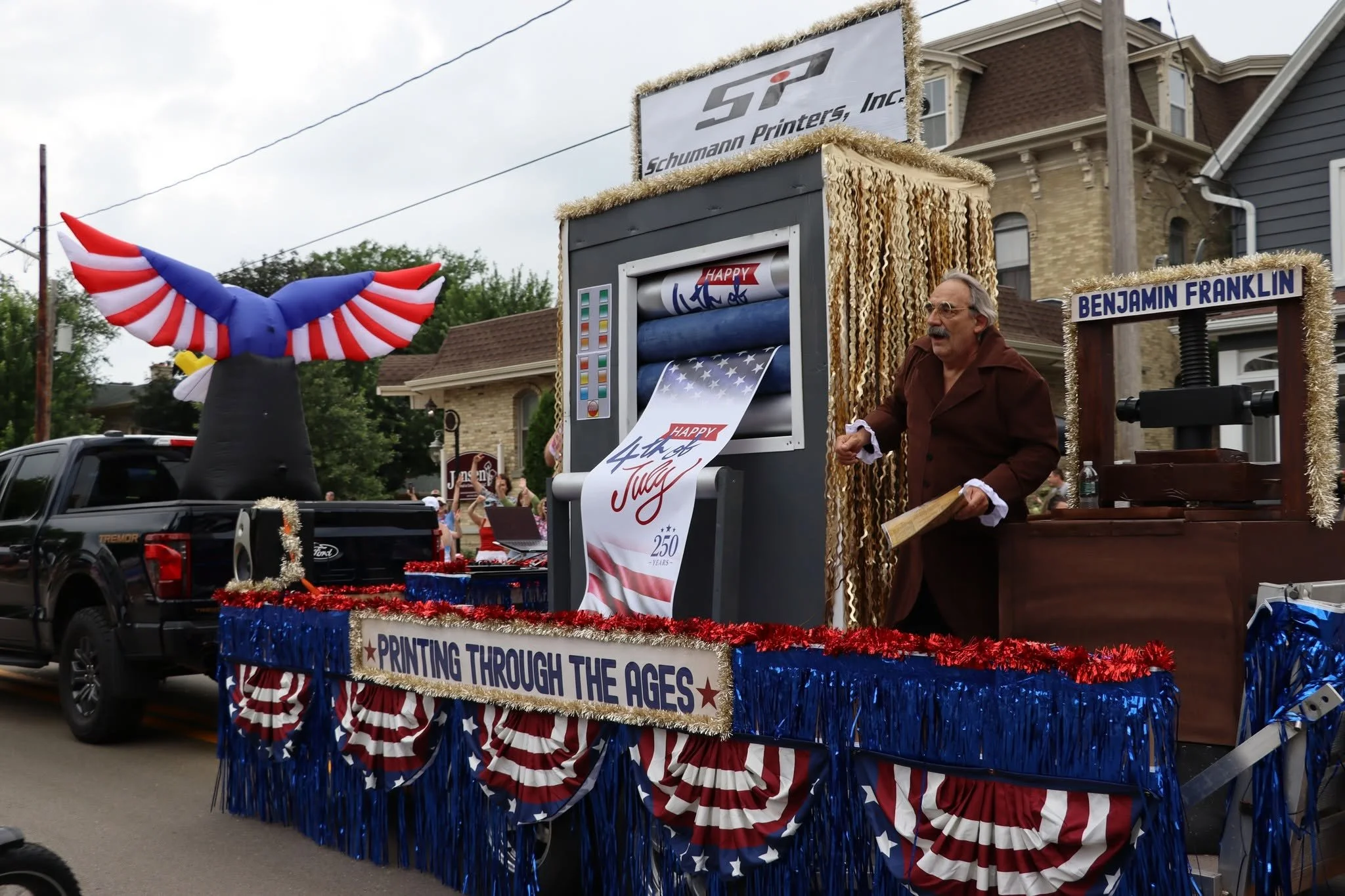 Schumann Printers Earns Second Place at the Columbus Fourth of July Parade with "Printing Through the Ages" Float