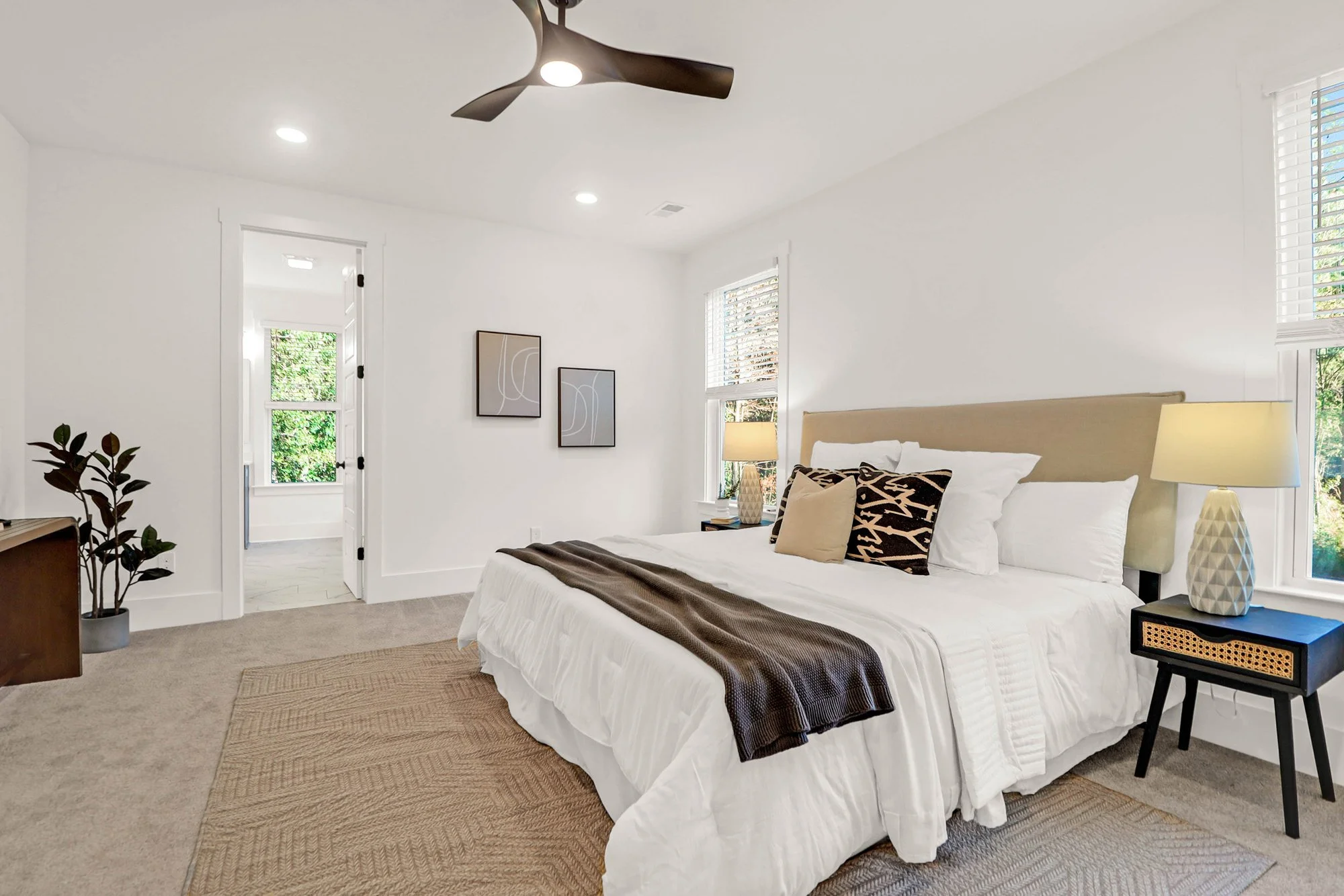 bed and nightstands in a large bedroom