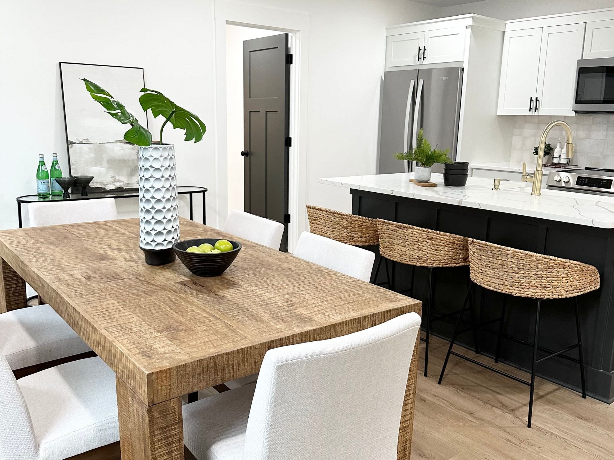 kitchen table and chairs with artwork and hutch