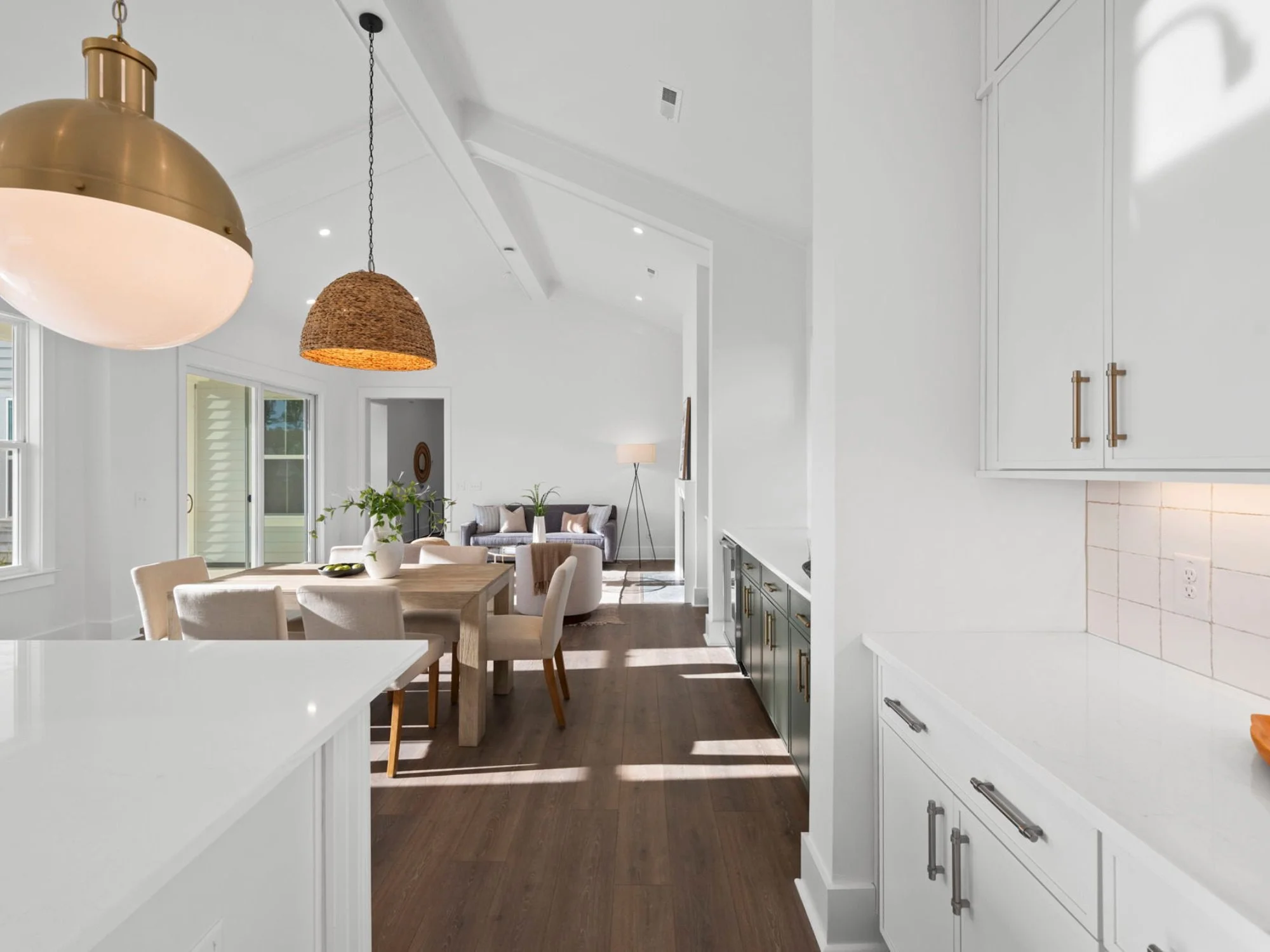 kitchen with table and chairs opened up to the den - benefits of home staging