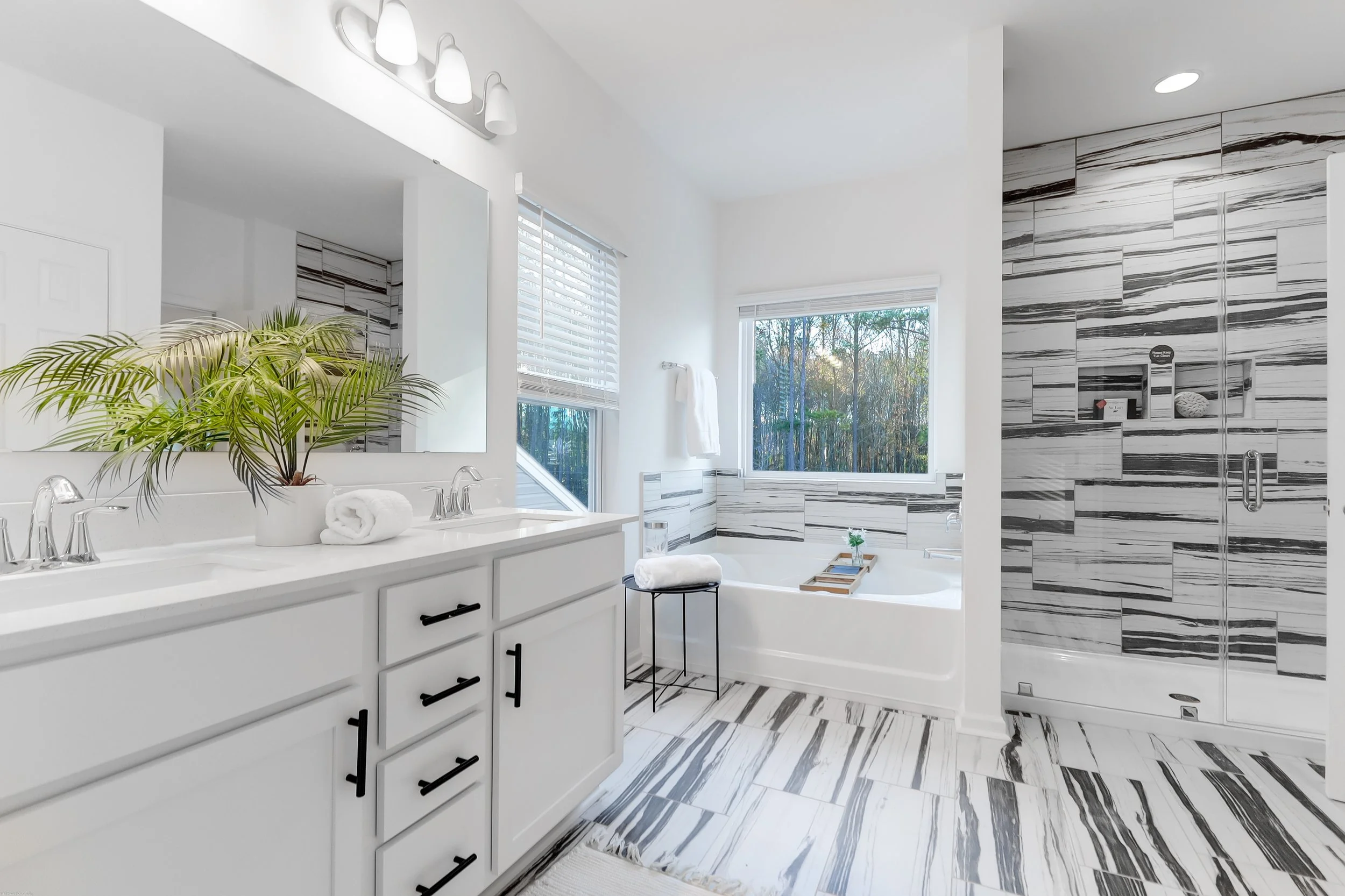 grey and white bathroom with plant
