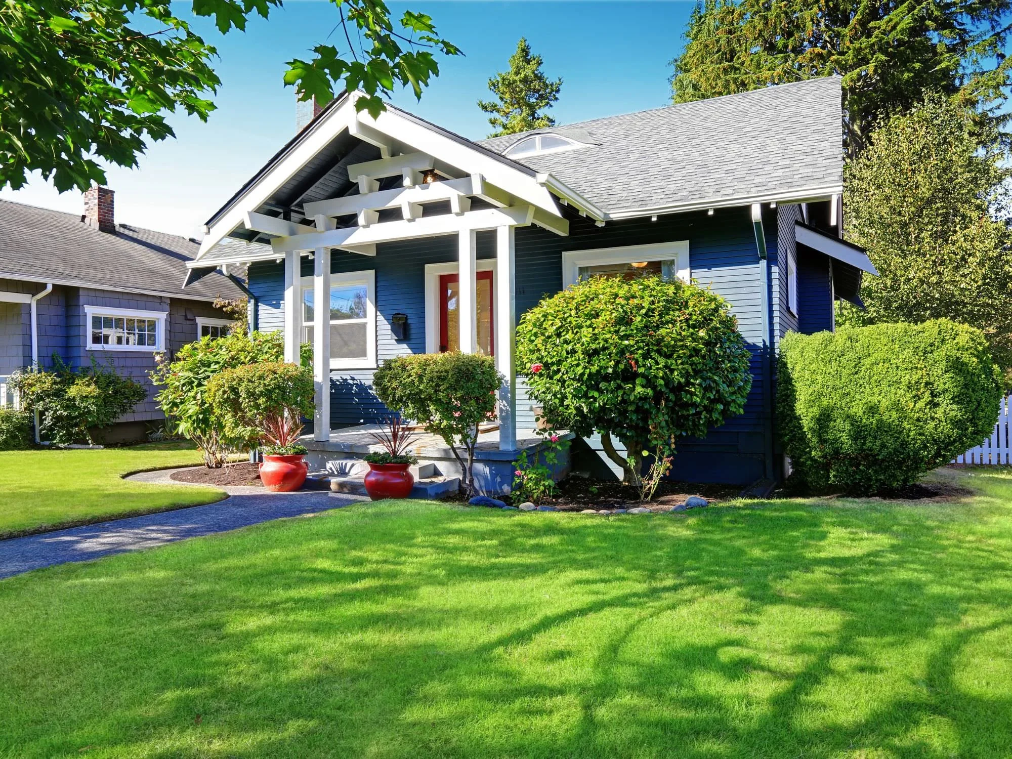 green thick grass and thick bushes - curb appeal ideas