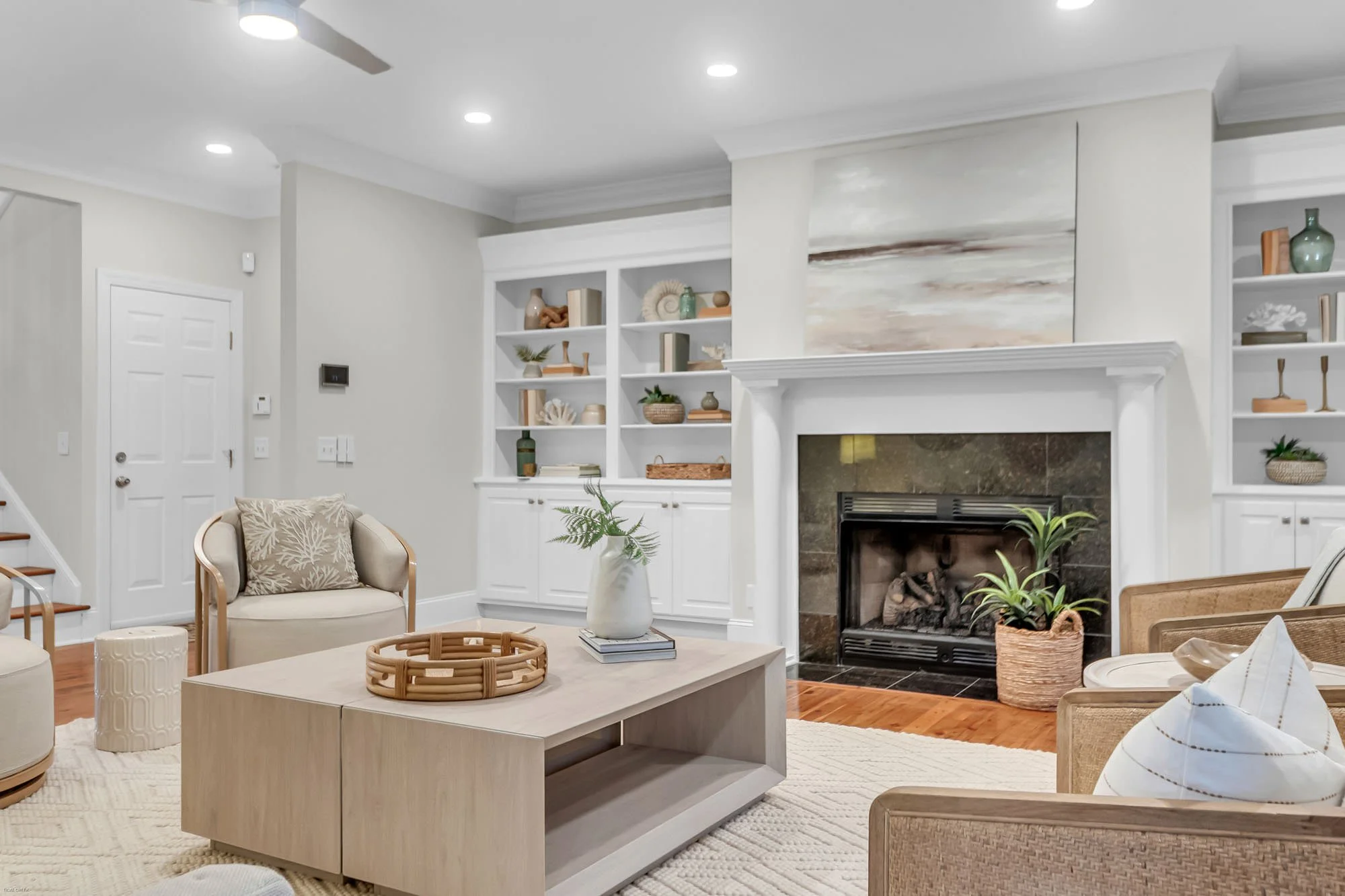 living room with chairs and coffee table - real estate home staging