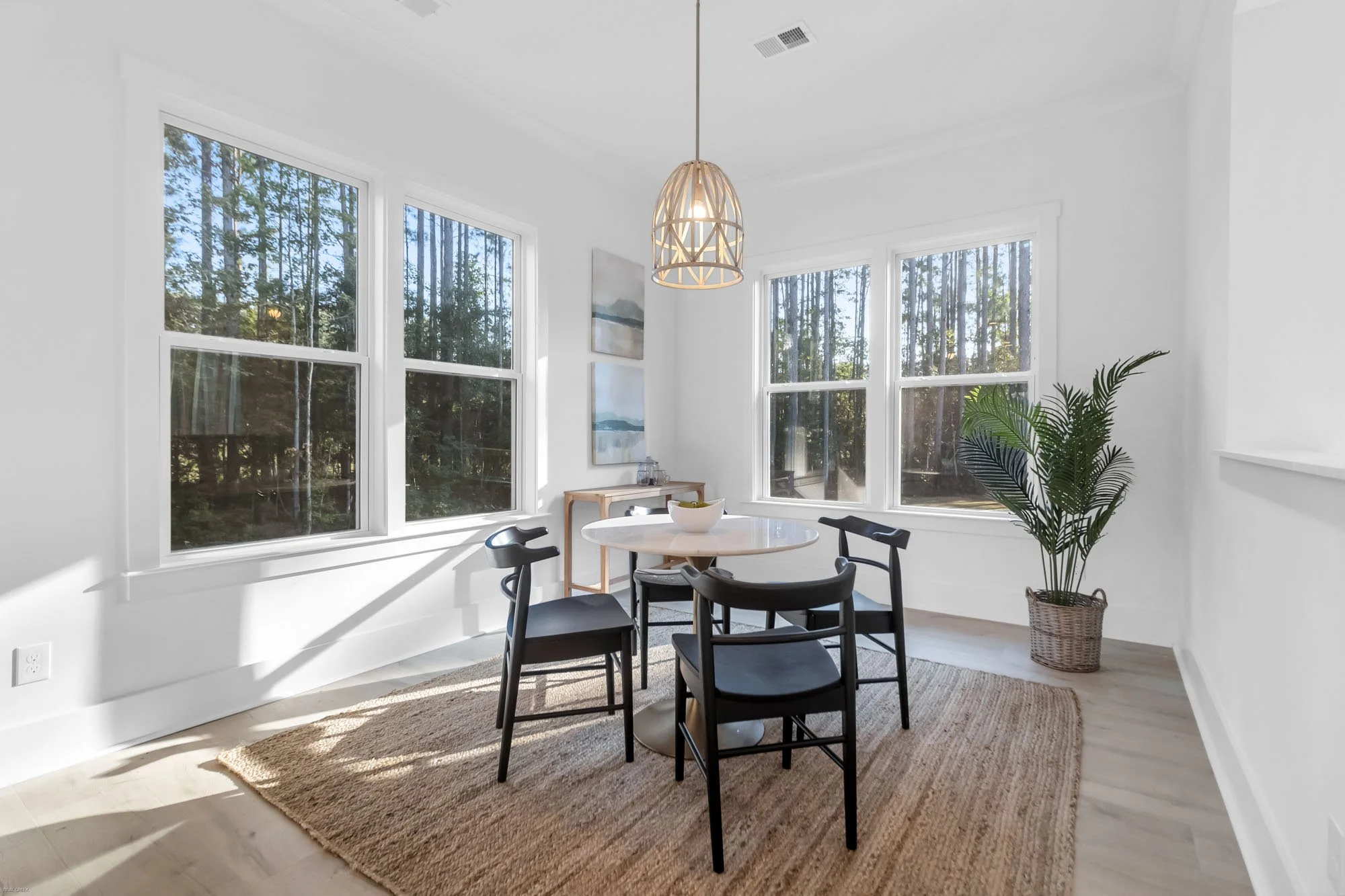 table and chairs set up in sunroom