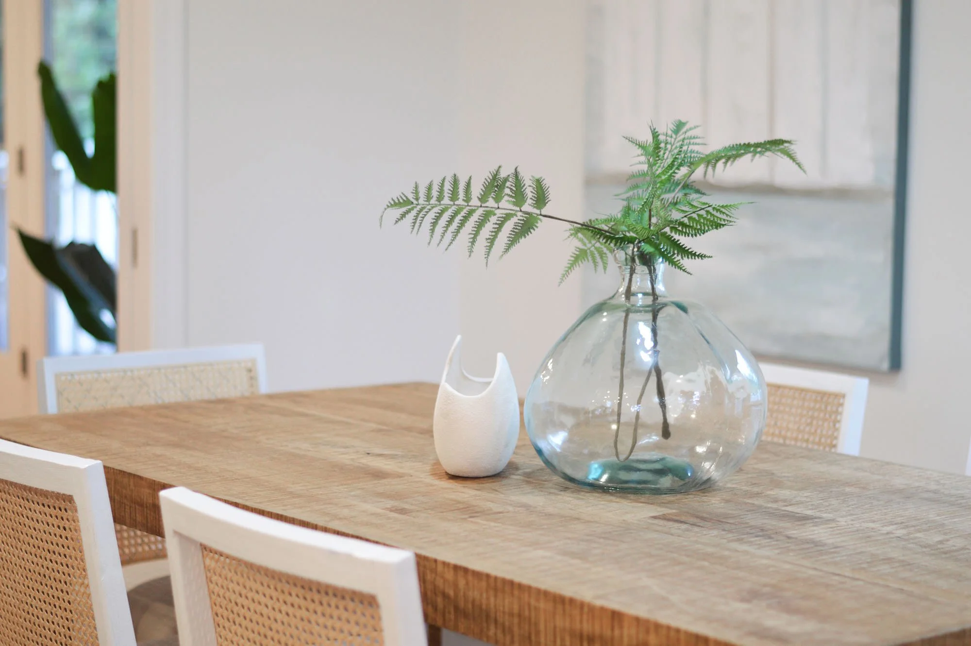 table with plant and decorative vase - real estate home staging