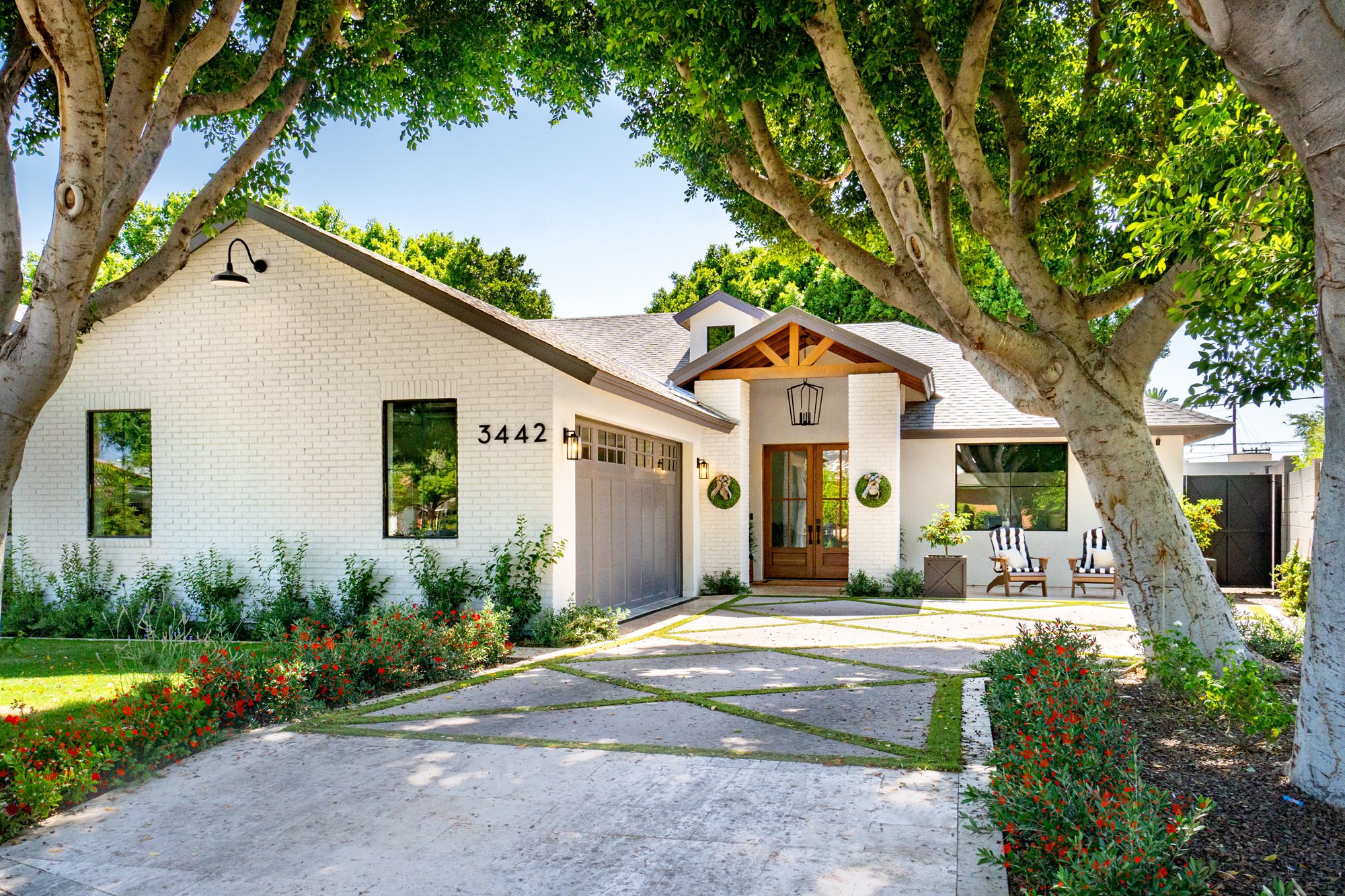 white brick home with maintained yard - curb appeal ideas