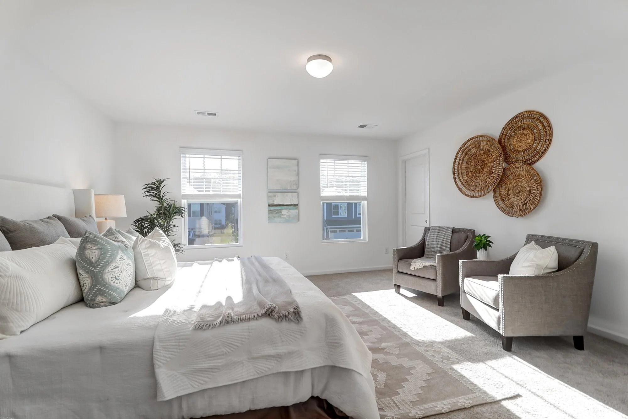 bed with two sitting chairs