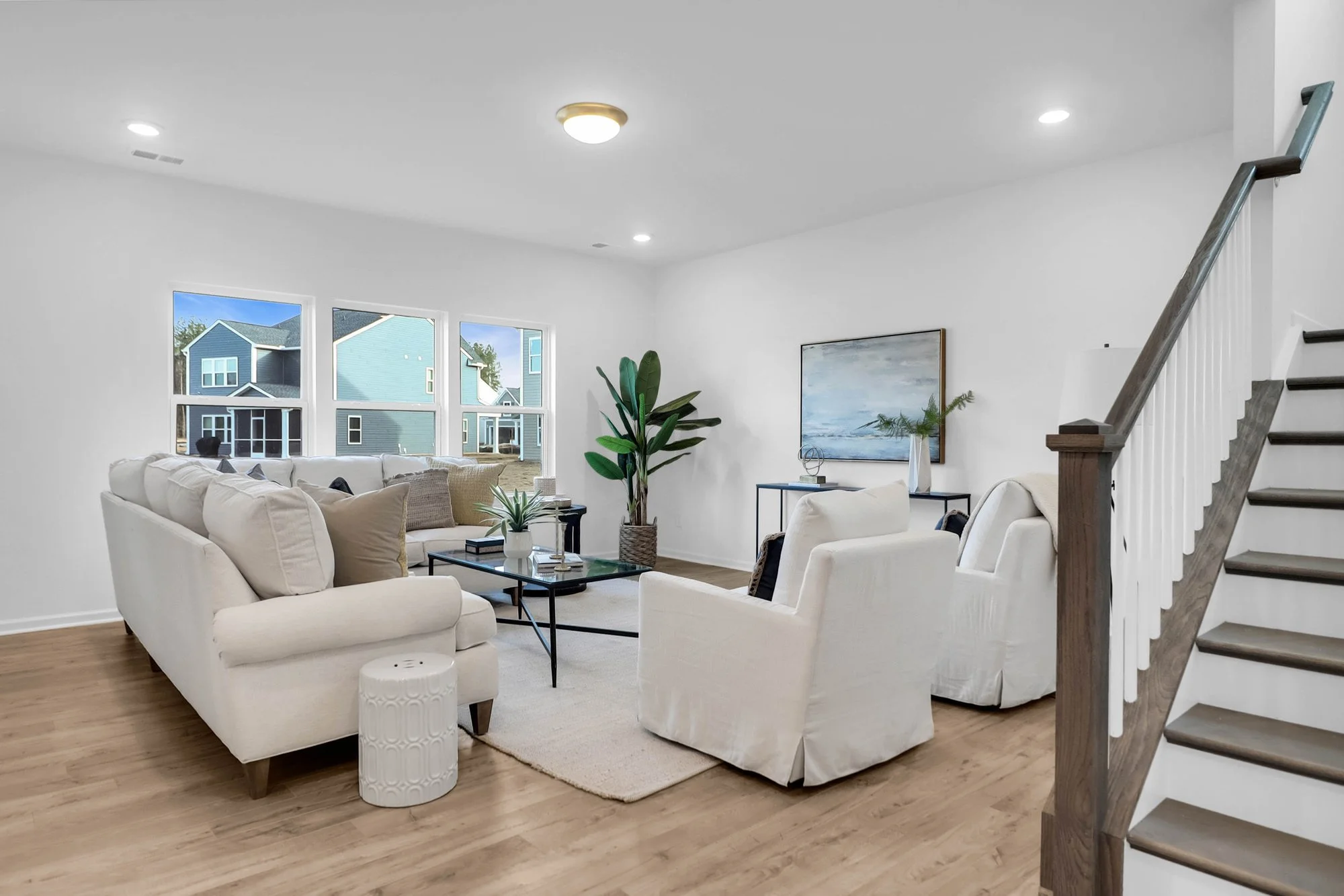 open floor plan with couch and chairs and coffee table