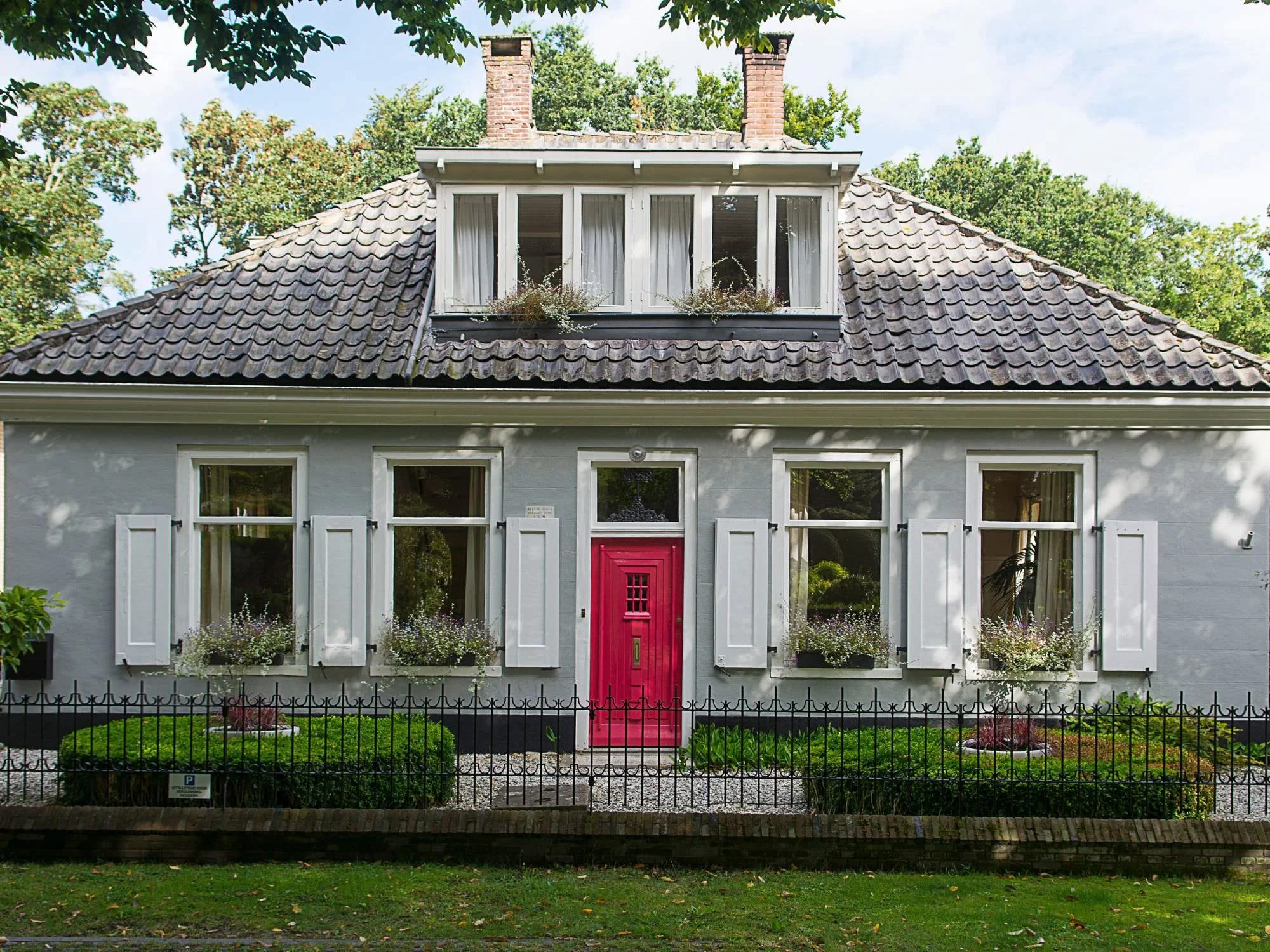 stunning grey home with perfectly manicured yard - curb appeal ideas