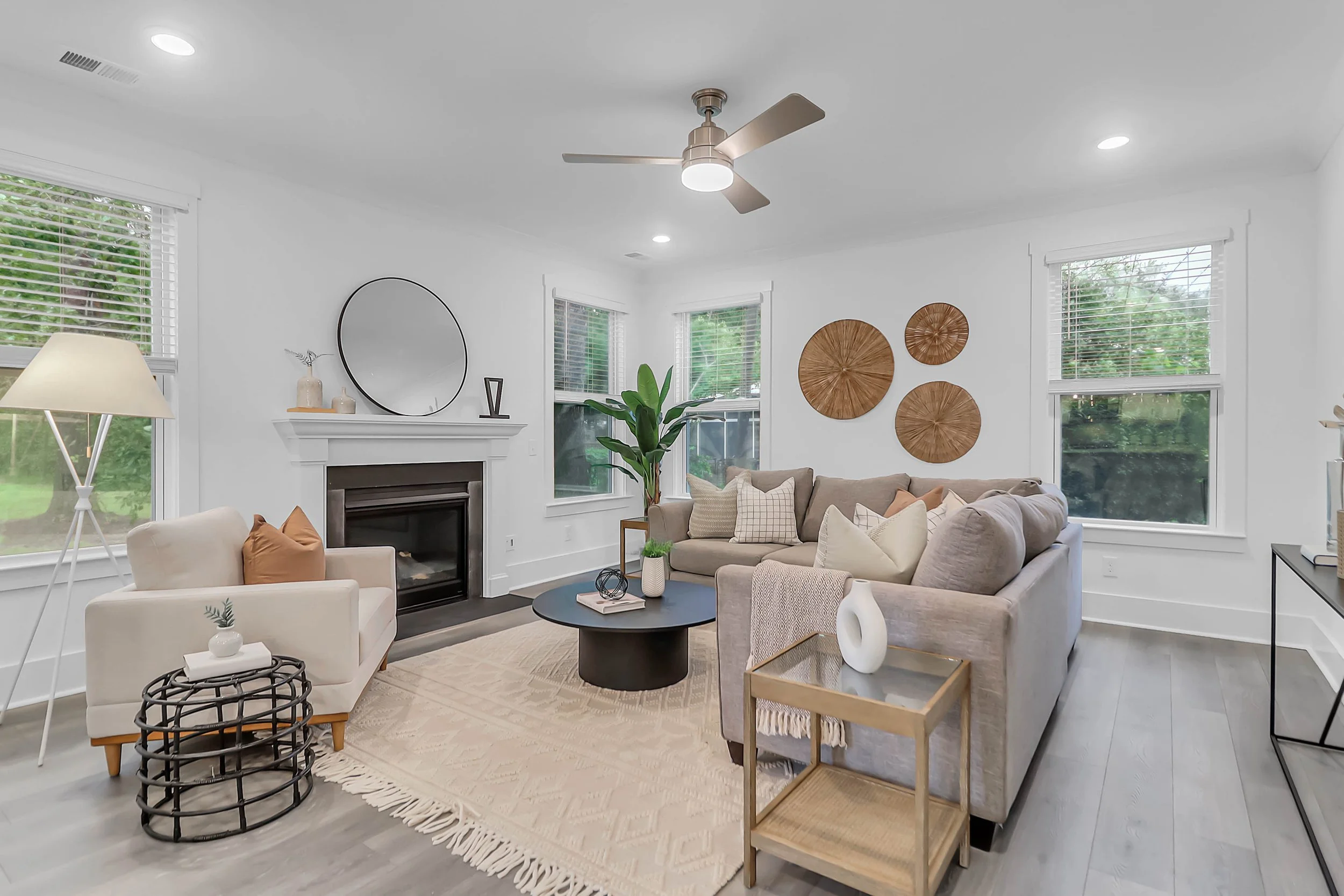 small room with chairs, coffee tables and couches - living room staging charleston