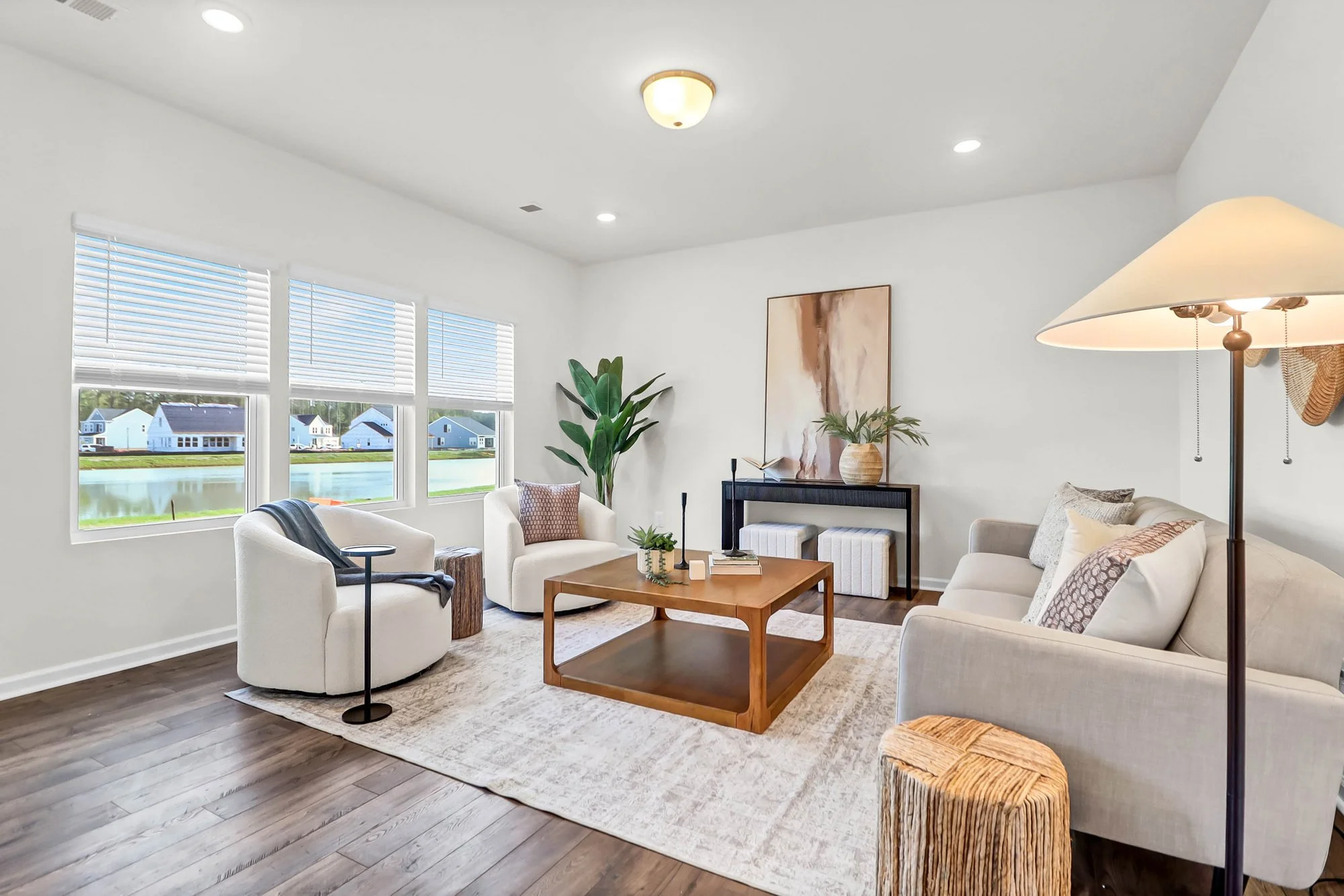 seating chairs and couch, coffee table and artwork - living room staging charleston