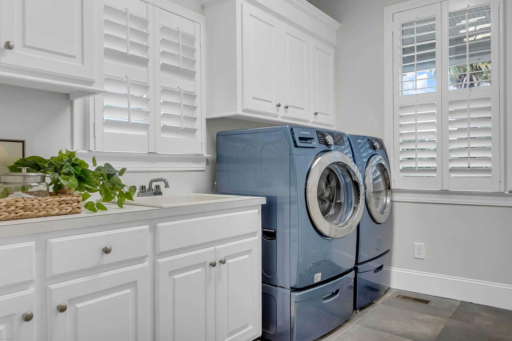 laundry/mud room with wicker tray with plant - home staging tips charleston, SC