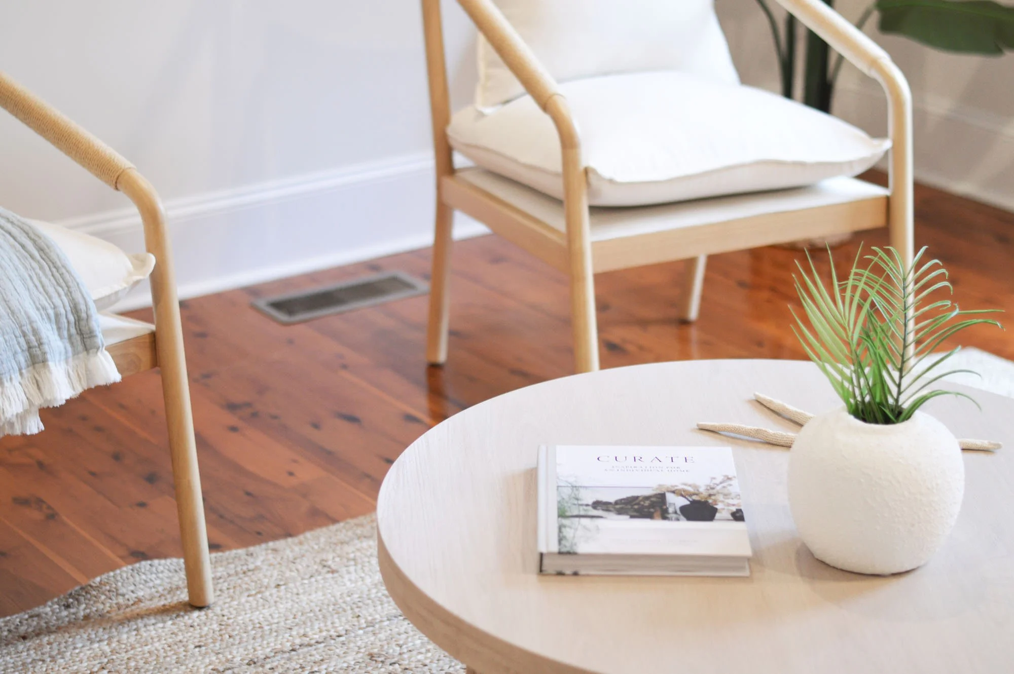 2 chairs, coffee table with plant and book - home staging tips charleston, SC