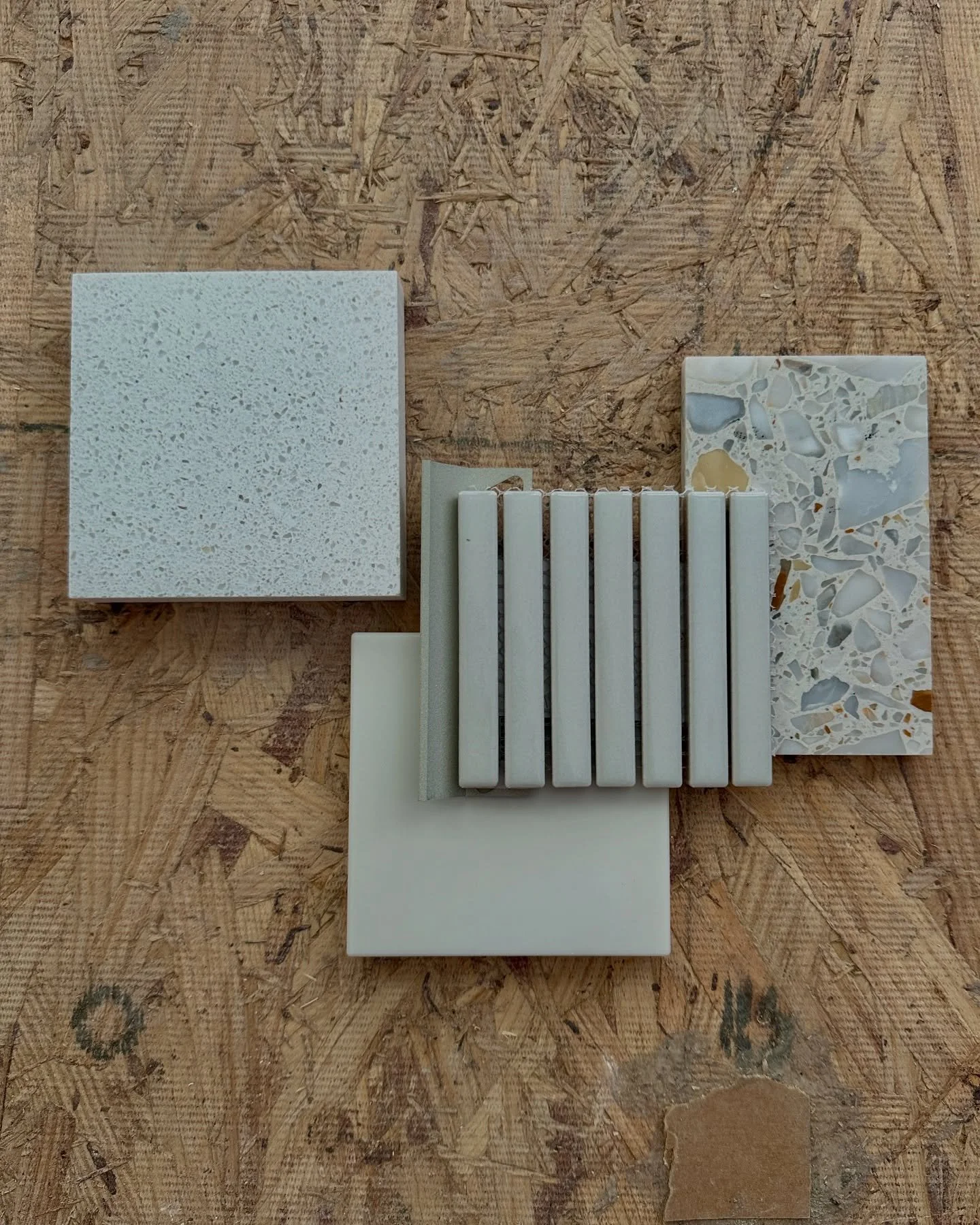 Reviewing finishes for the bathrooms at our Central Park South renovation project.

Ceramic mosaic wall tiles with metal trims
Quartz top
Solid surface shower bench
Terrazzo tile floor