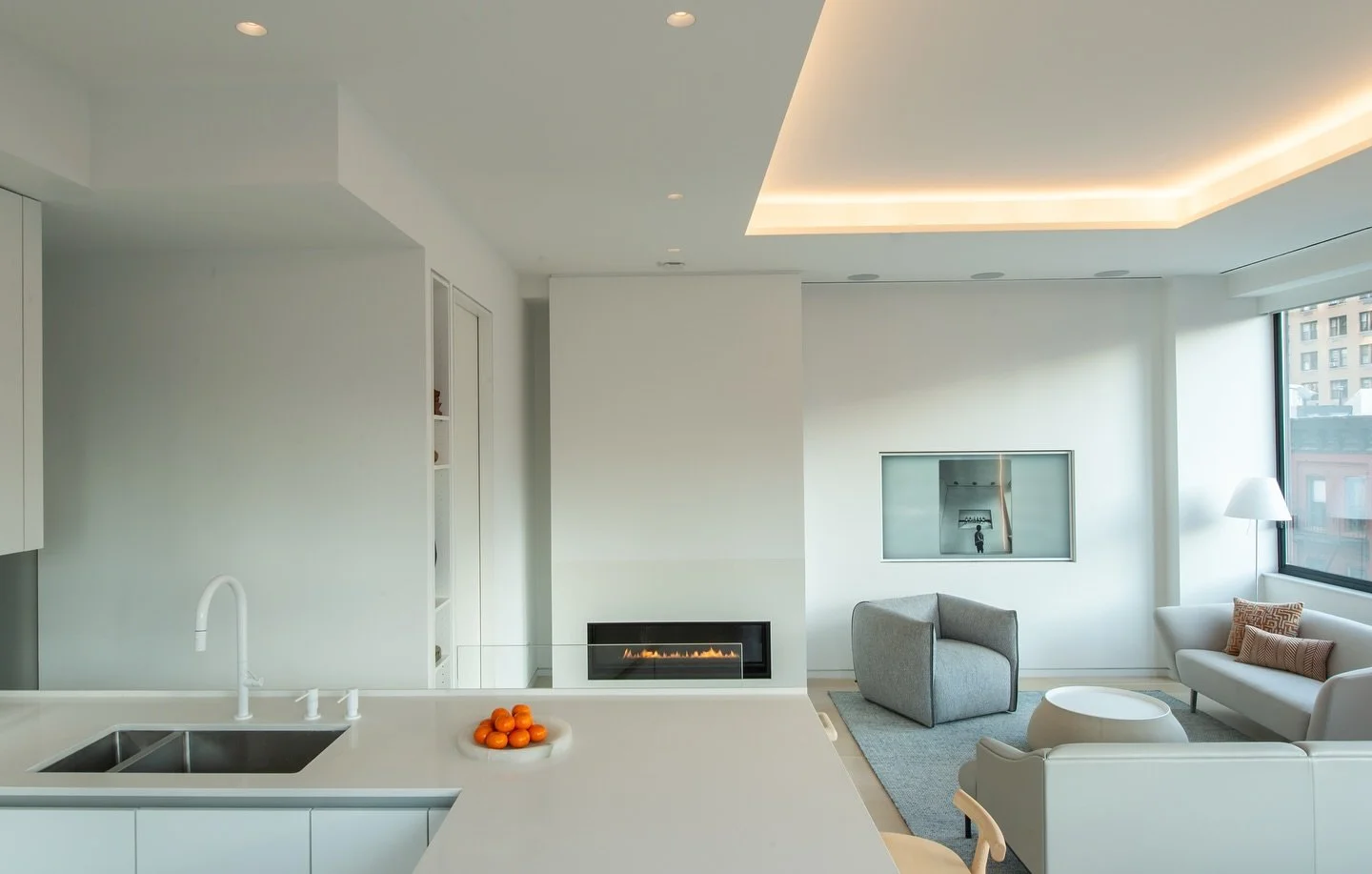 Open living space of our duplex renovation in Midtown Manhattan / Hells Kitchen. 

This was a complete gut renovation where we replaced window PTAC units with central air, all new electrical and plumbing, and expanded a small utility room to add an e