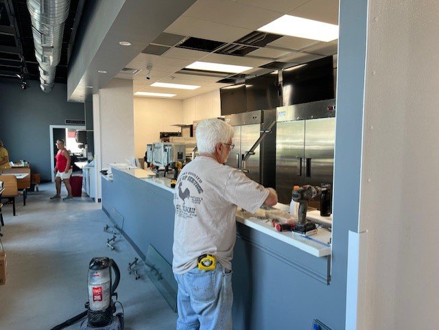 Customer ordering at the counter.