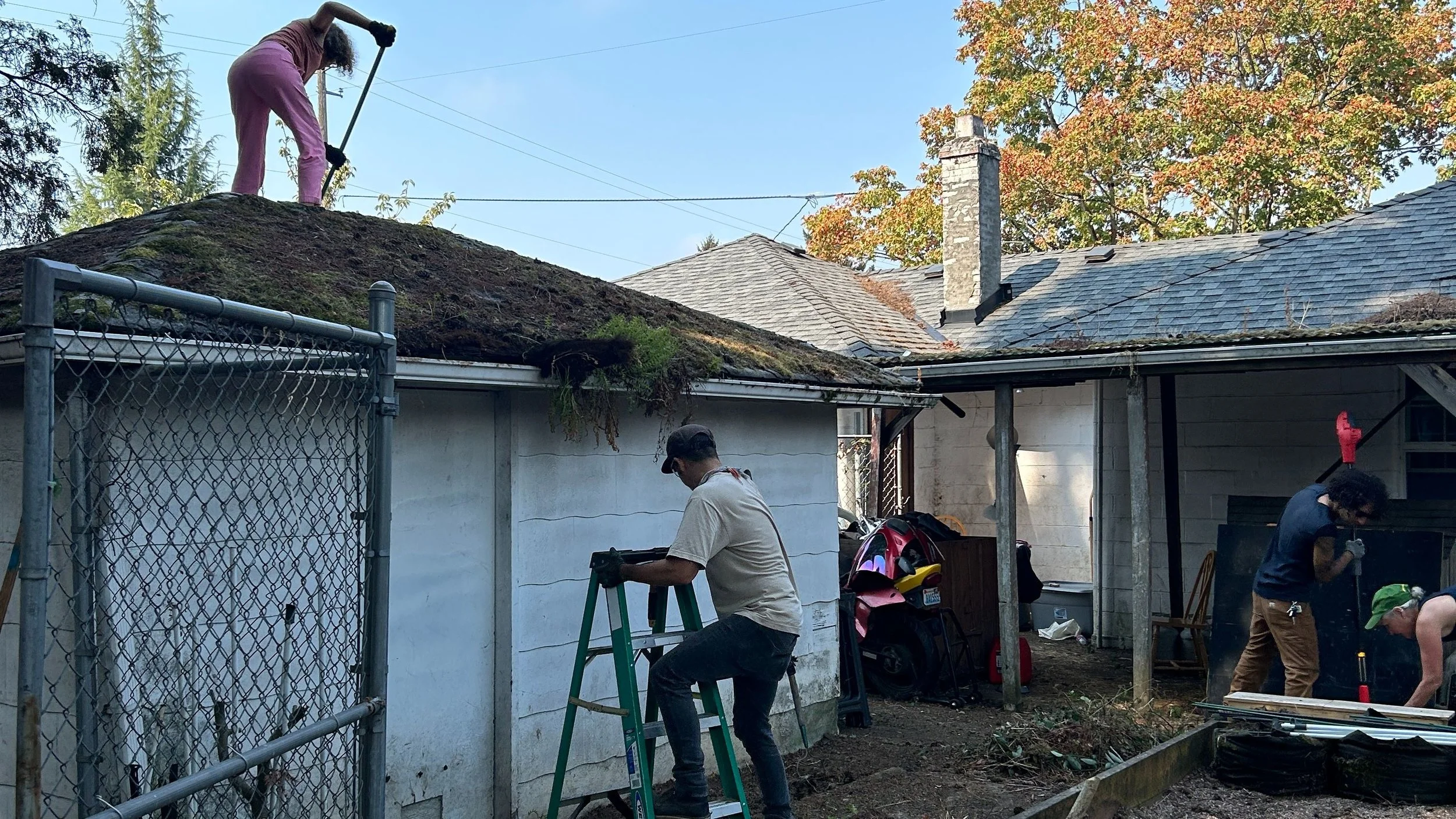 landscape photo of volunteers cleaning a house