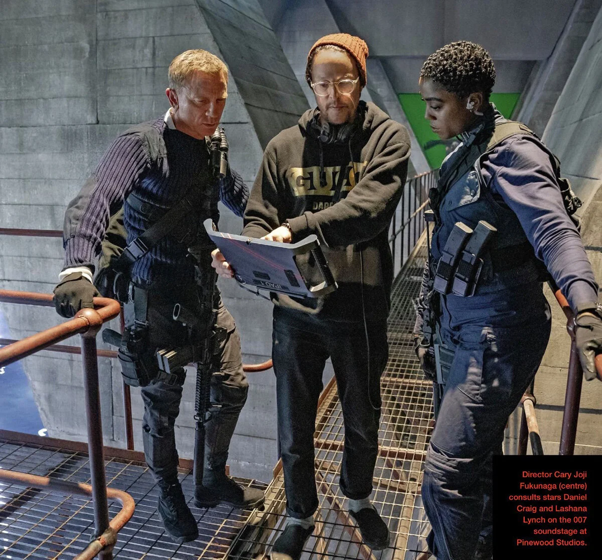 irector Cary Fukunaga with actors Daniel Craig (James Bond) and Lashana Lynch (Nomi) in their covert outfits.jpg
