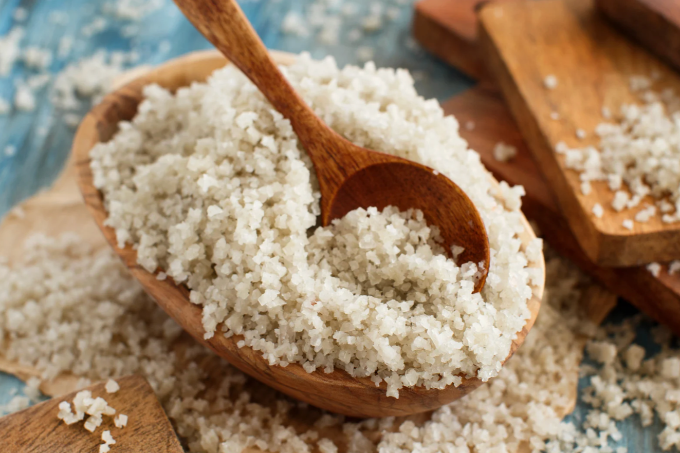 celtic sea salt in wooden bowl with wooden spoon