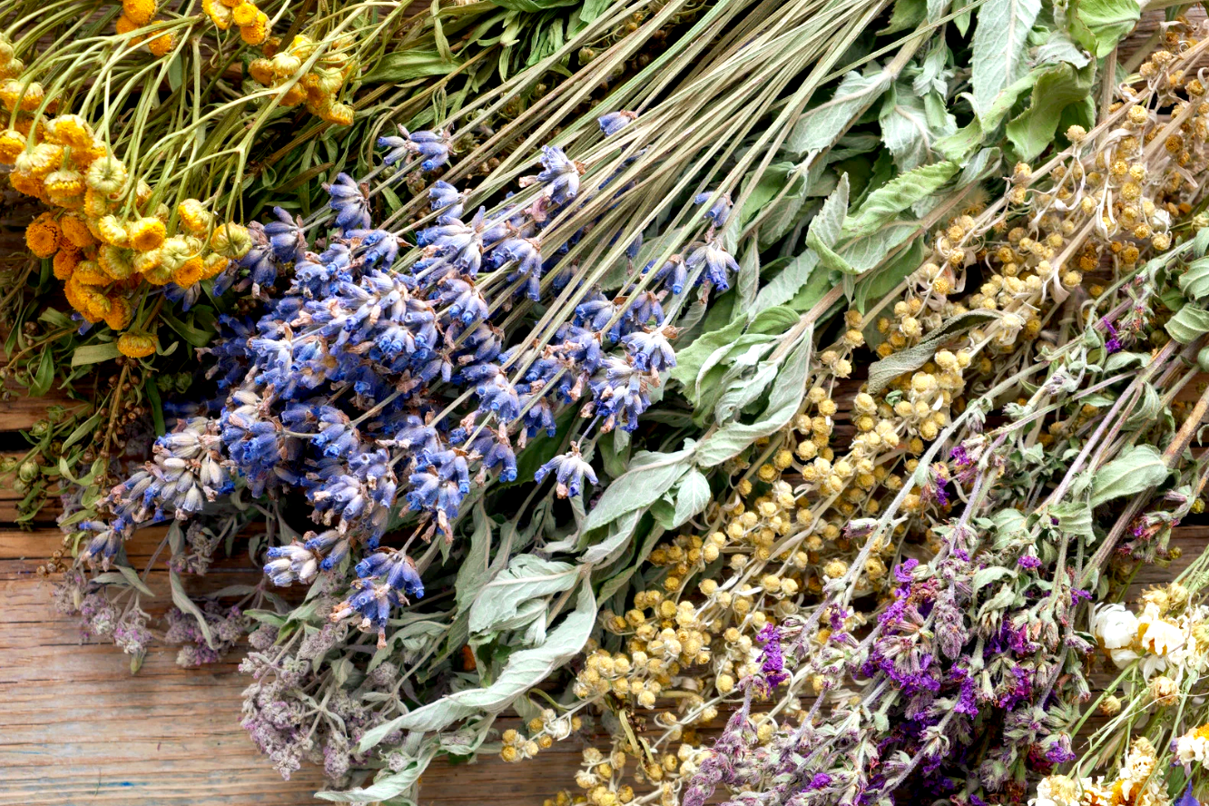 dried edible flowers on wooden table