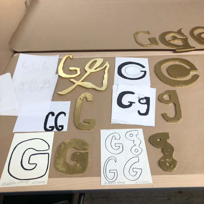 Original “G”art, paired with gold replicated wooden pieces.