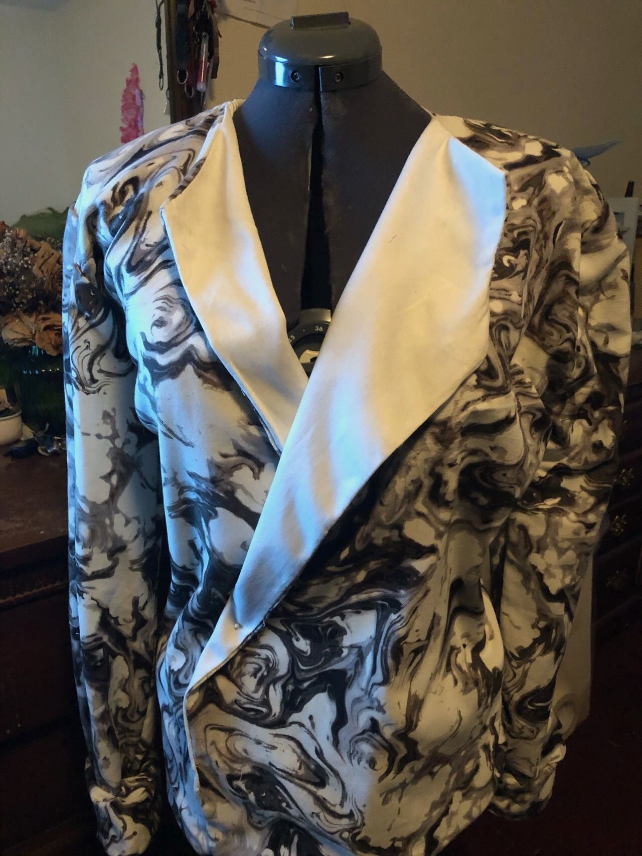 A reversable blazer constructed in Omolayole’s bedroom.