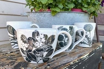 Making wonderful, functional porcelain pottery in an old cow barn on a farm where she lives with her family, Glynnis Lessing finds joy and inspiration in each piece she creates by hand.  Glynnis paints images in black slip with colored underglazes on