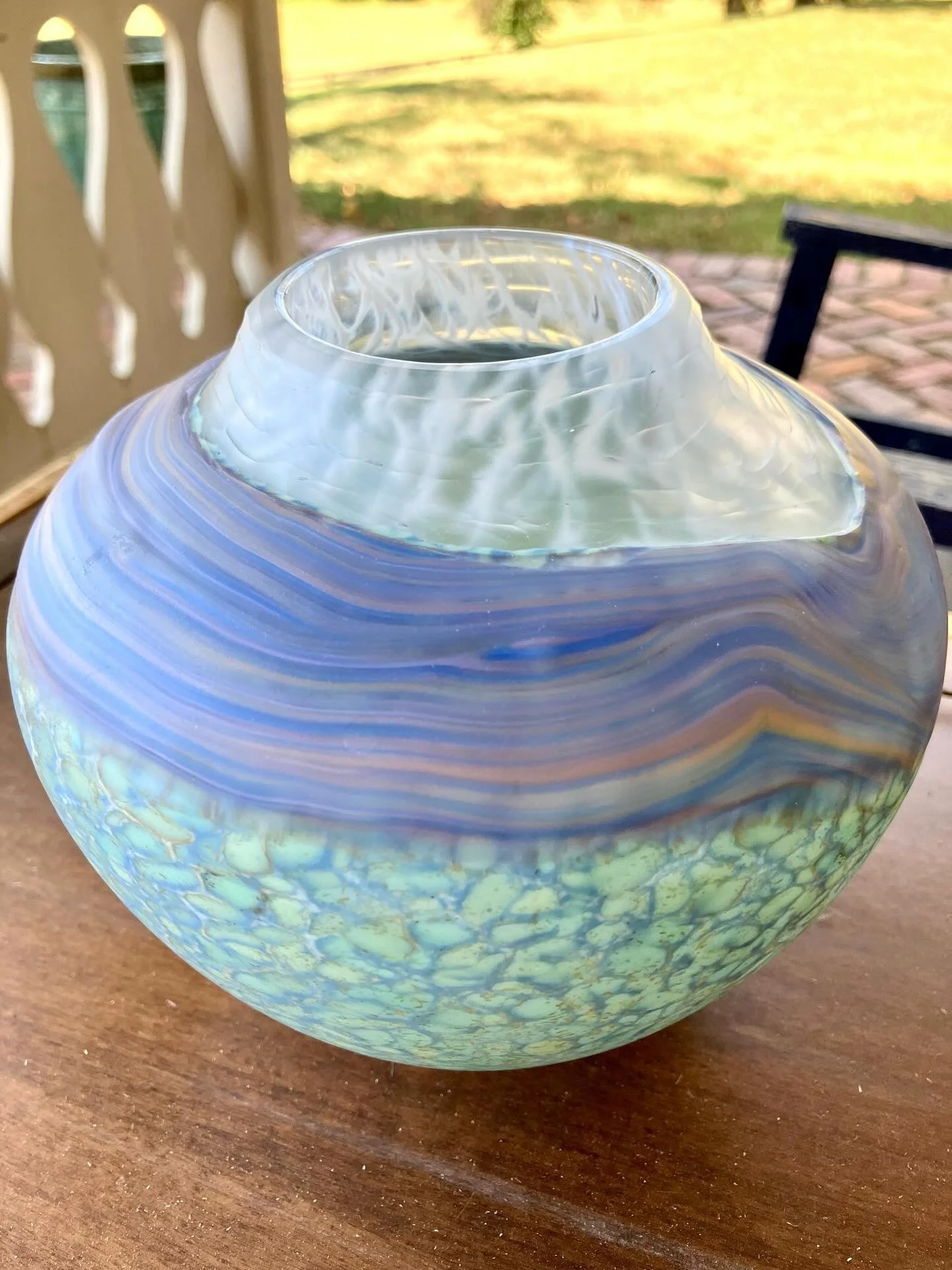 The sun-dappled scenes of impressionist paintings seem to present themselves in the colors, textures, and surfaces of Thomas Spake’s hand-blown glass vessels and sculptures.
Thomas individually treats each piece resulting in a smooth, matte fin