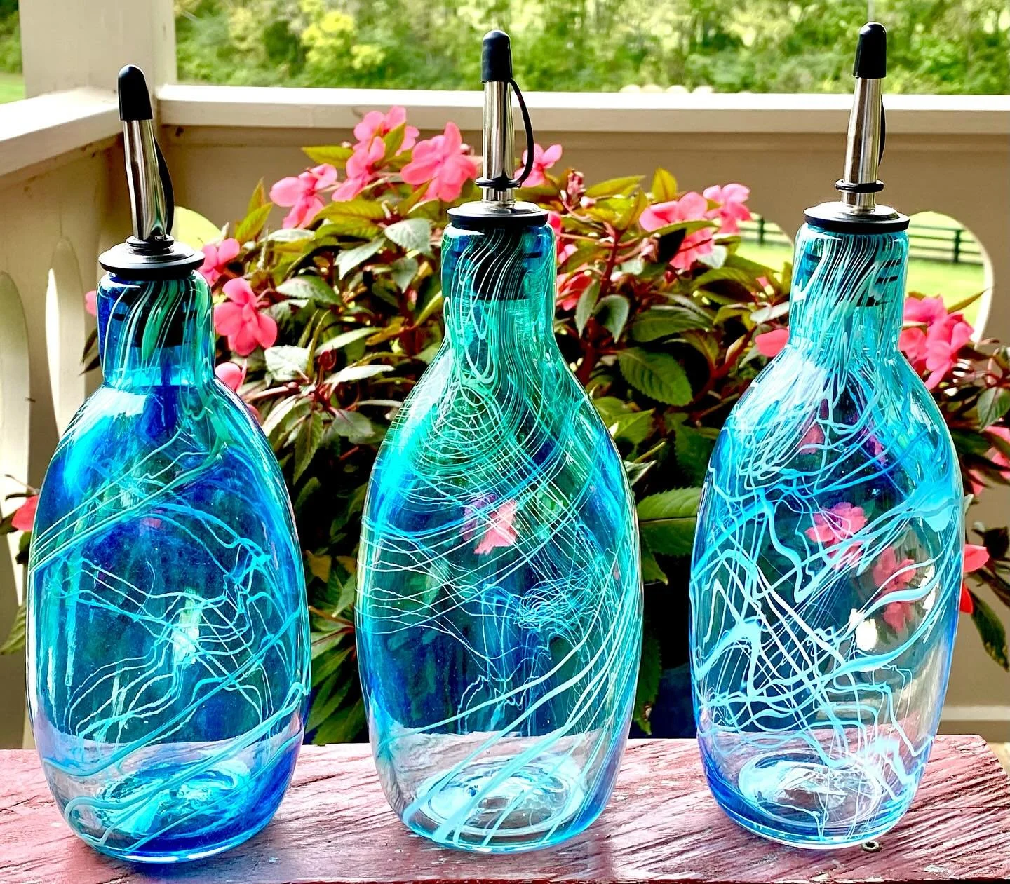 Glass artist John Mauro blends traditional glass bowing techniques with a touch of modern aesthetics.  He focuses on creating functional, yet beautiful objects.  His hand blown olive oil containers are an exquisite example of his artistic talent. 
#g