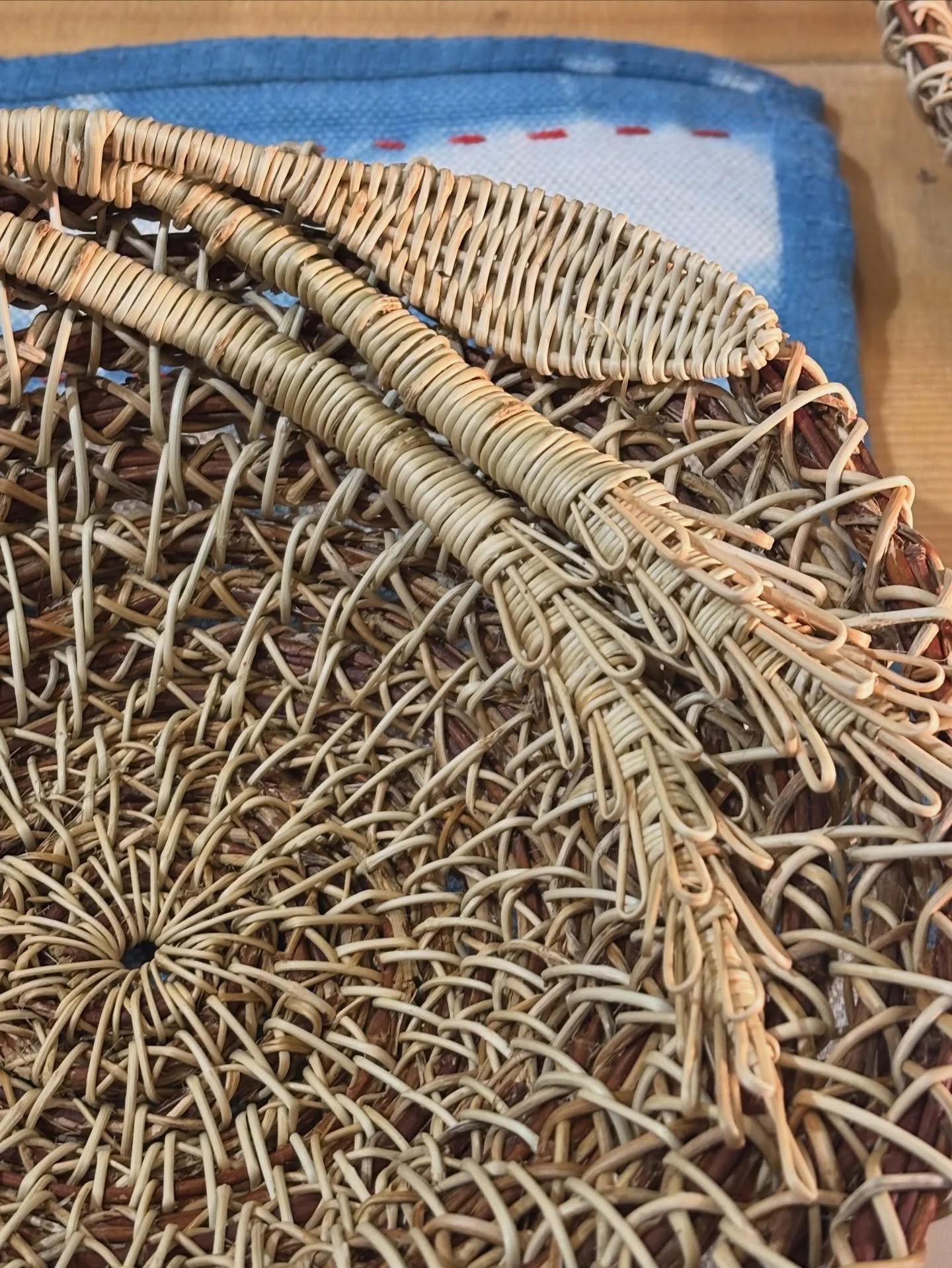 Using wild honeysuckle, Anne Scarpa McCauley makes beautifully unique coiled baskets from the vines found in the foothills of Virginia.  Anne began making honeysuckle baskets as a girl while out tending goats on her family farm.  She often had the jo