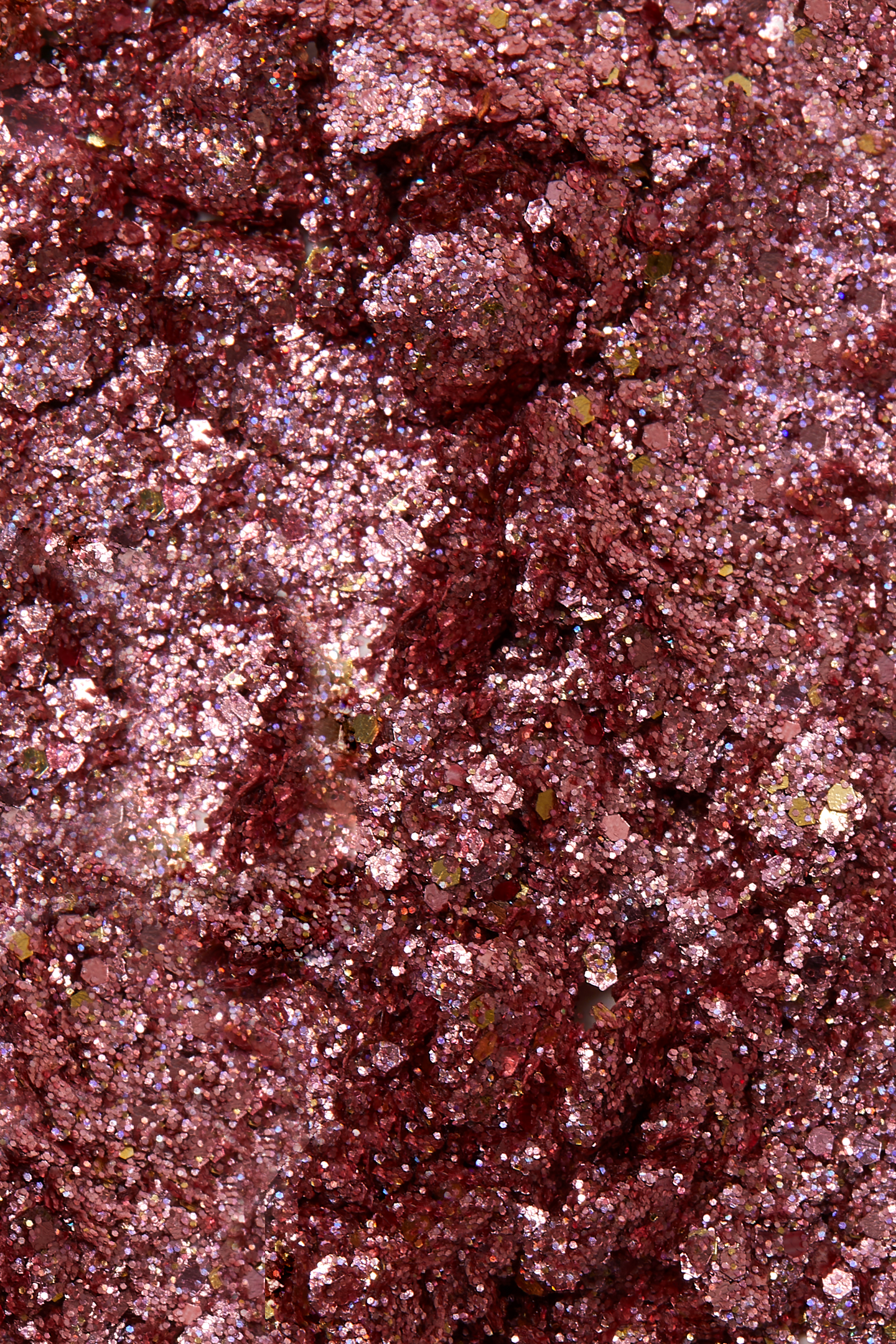 Shimmery rose gold sparkling plant based glitter cream in a vegan non toxic formula dries to a water resistant powder finish