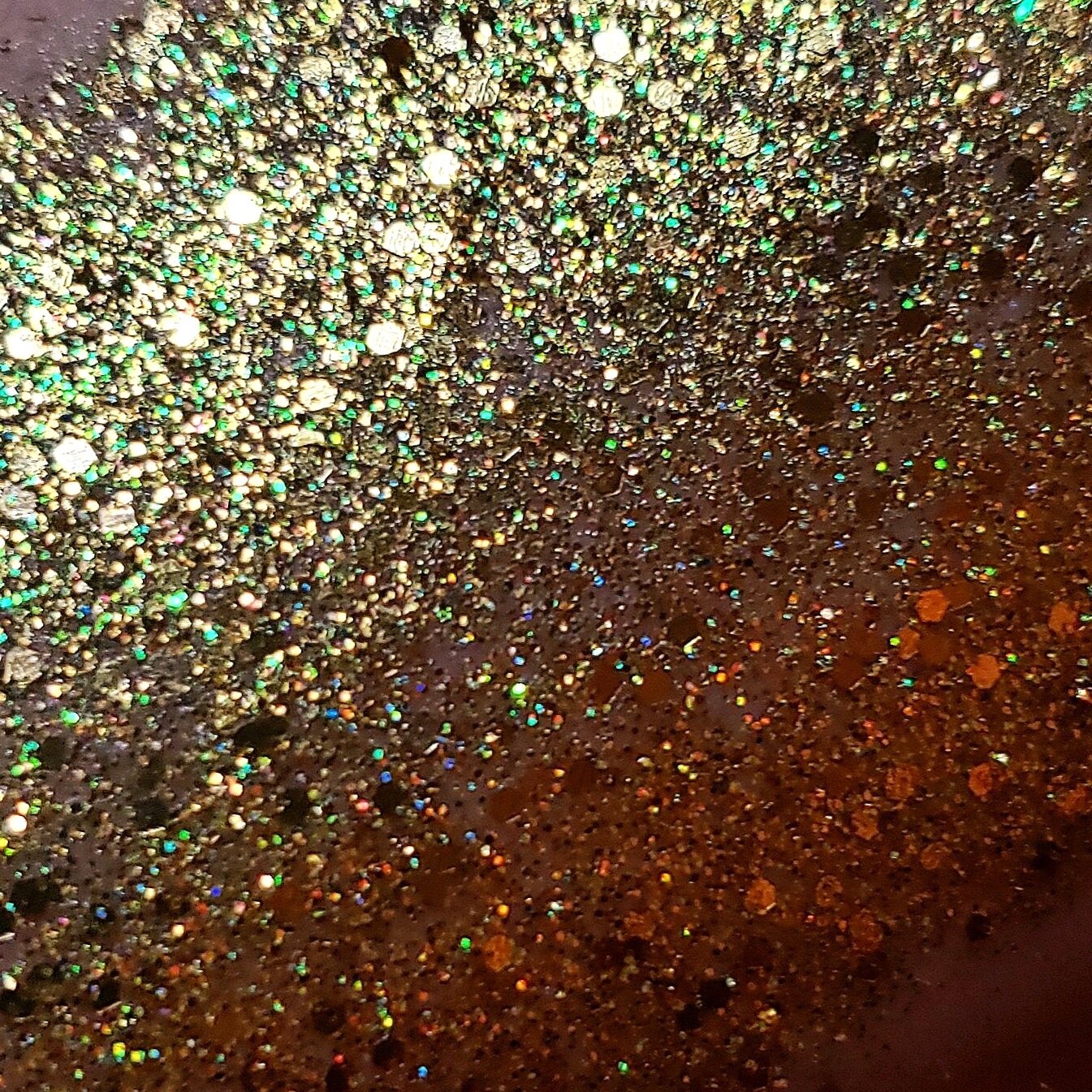 Shimmering Solid gold with iridescent sparkle of plant based glitter cream in a vegan non toxic formula dries to a water resistant powder finish