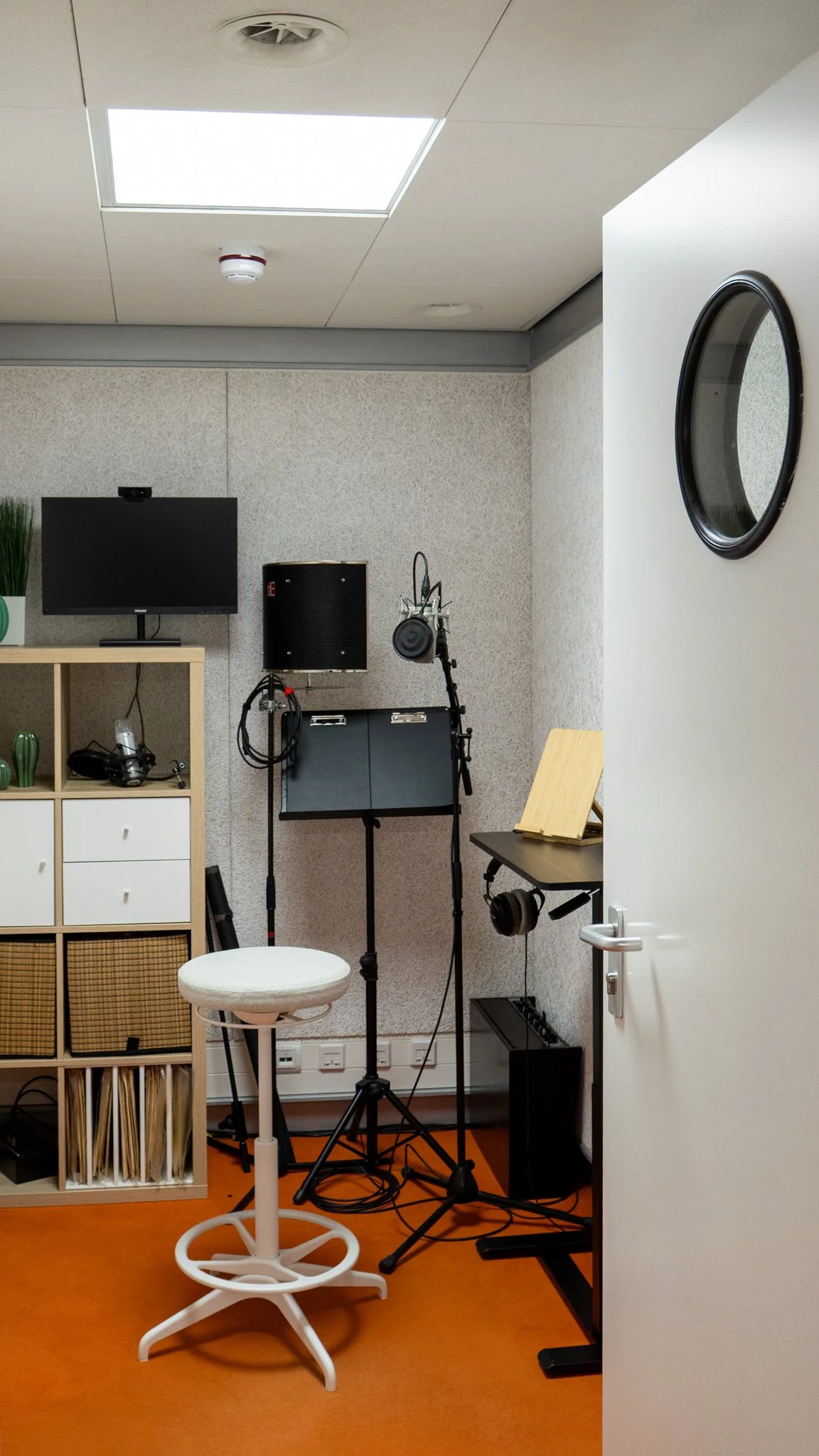 Recording booth with mic setup for voice-over recording