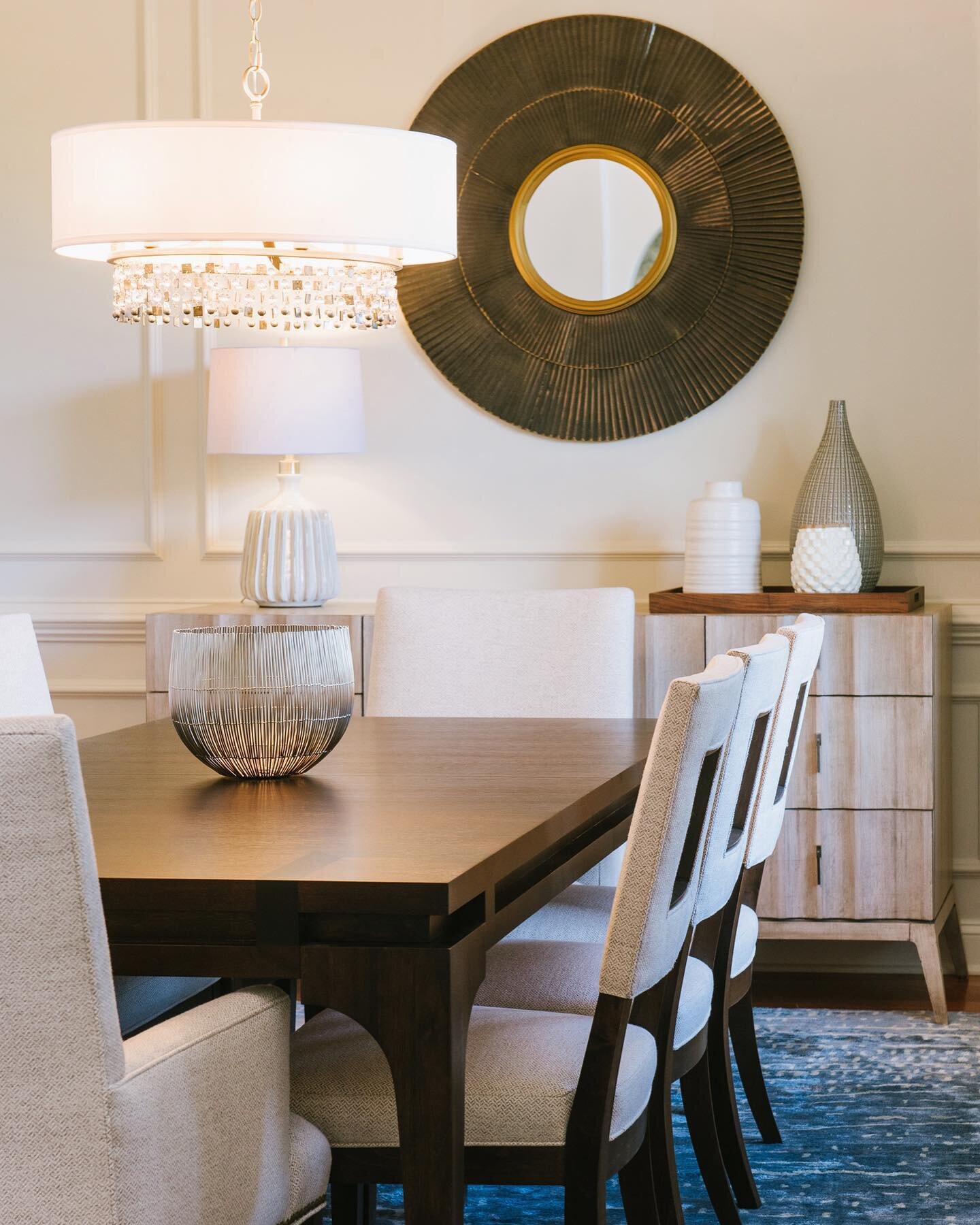 A dining  room dressed in neutrals. The design started with walls of tone on tone panels (adapting what was already there) and an amazing rug. The storage piece in a gray wash is one of my favorites. Swipe through the images to see where we started.